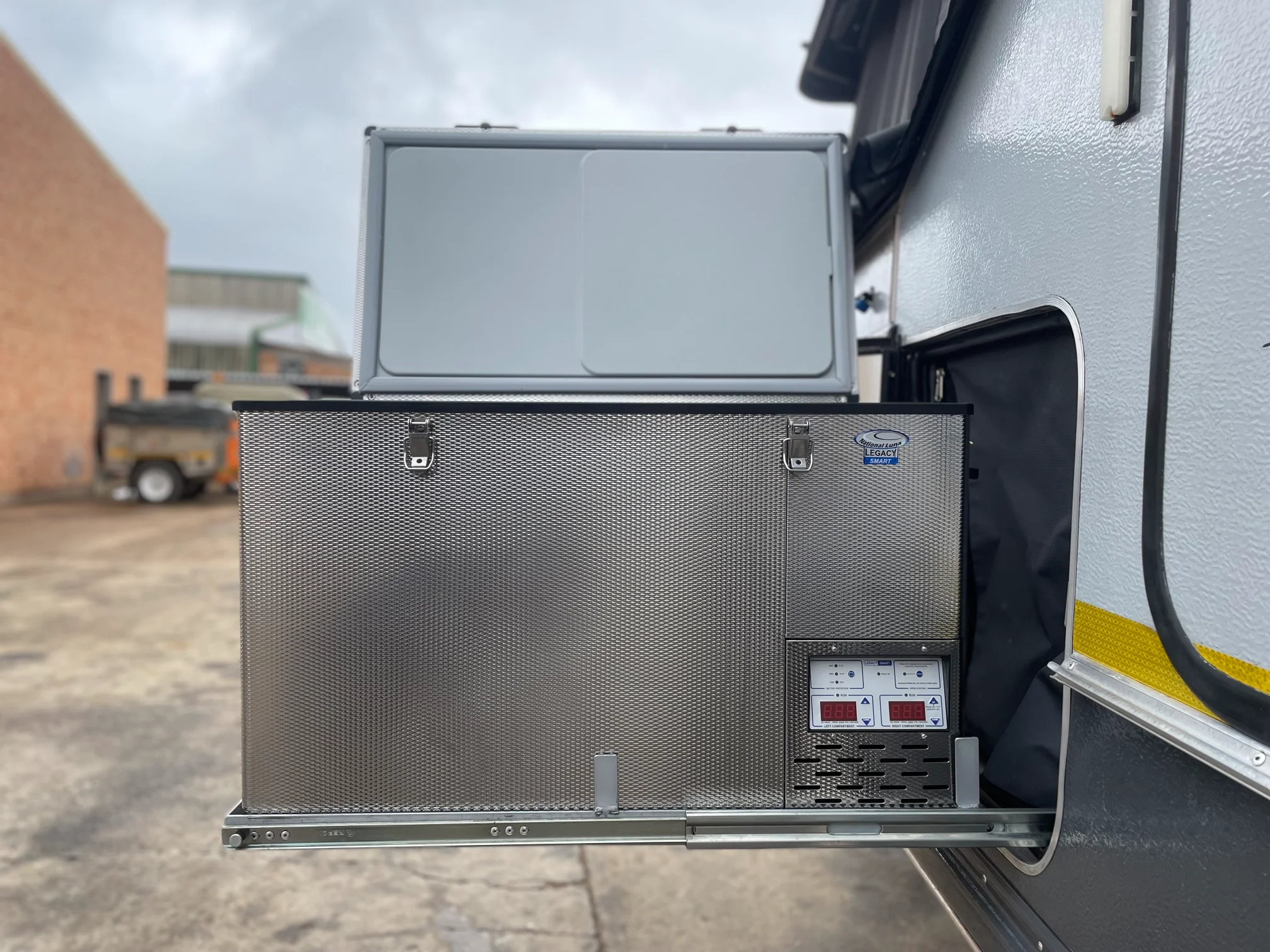 Under-slide fridge with caravan door closed