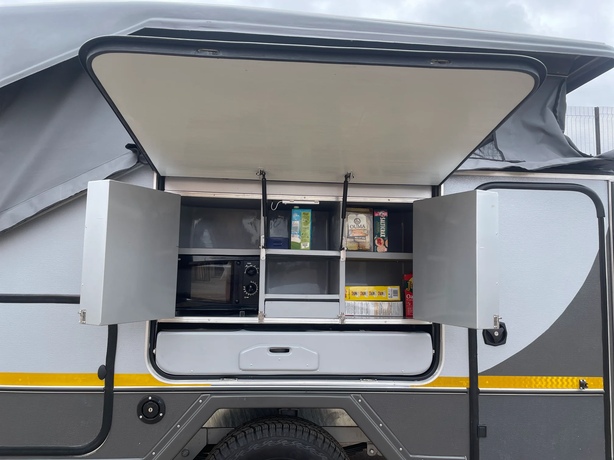 Full kitchen area with outer hatch open