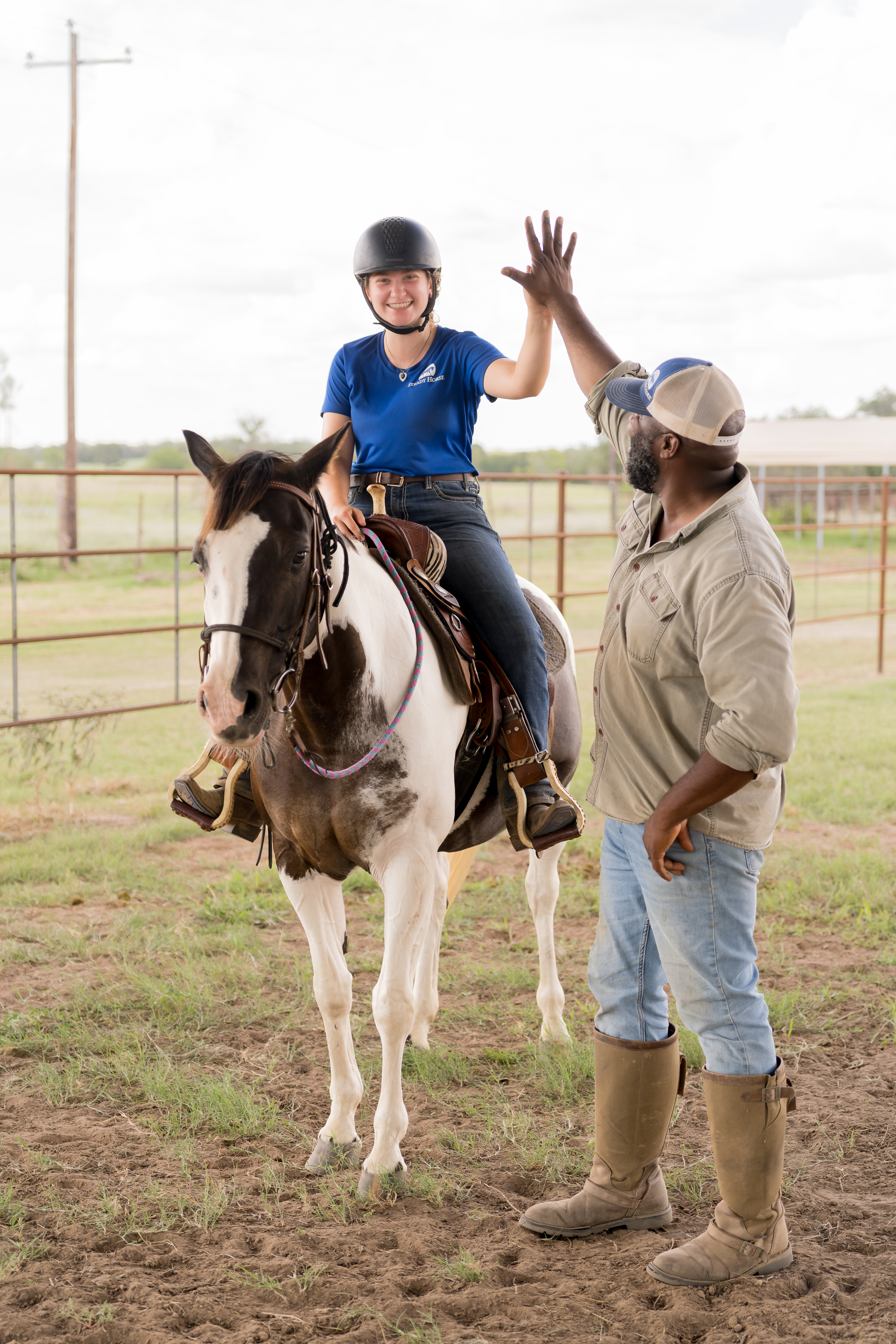 Noah high fiving a student