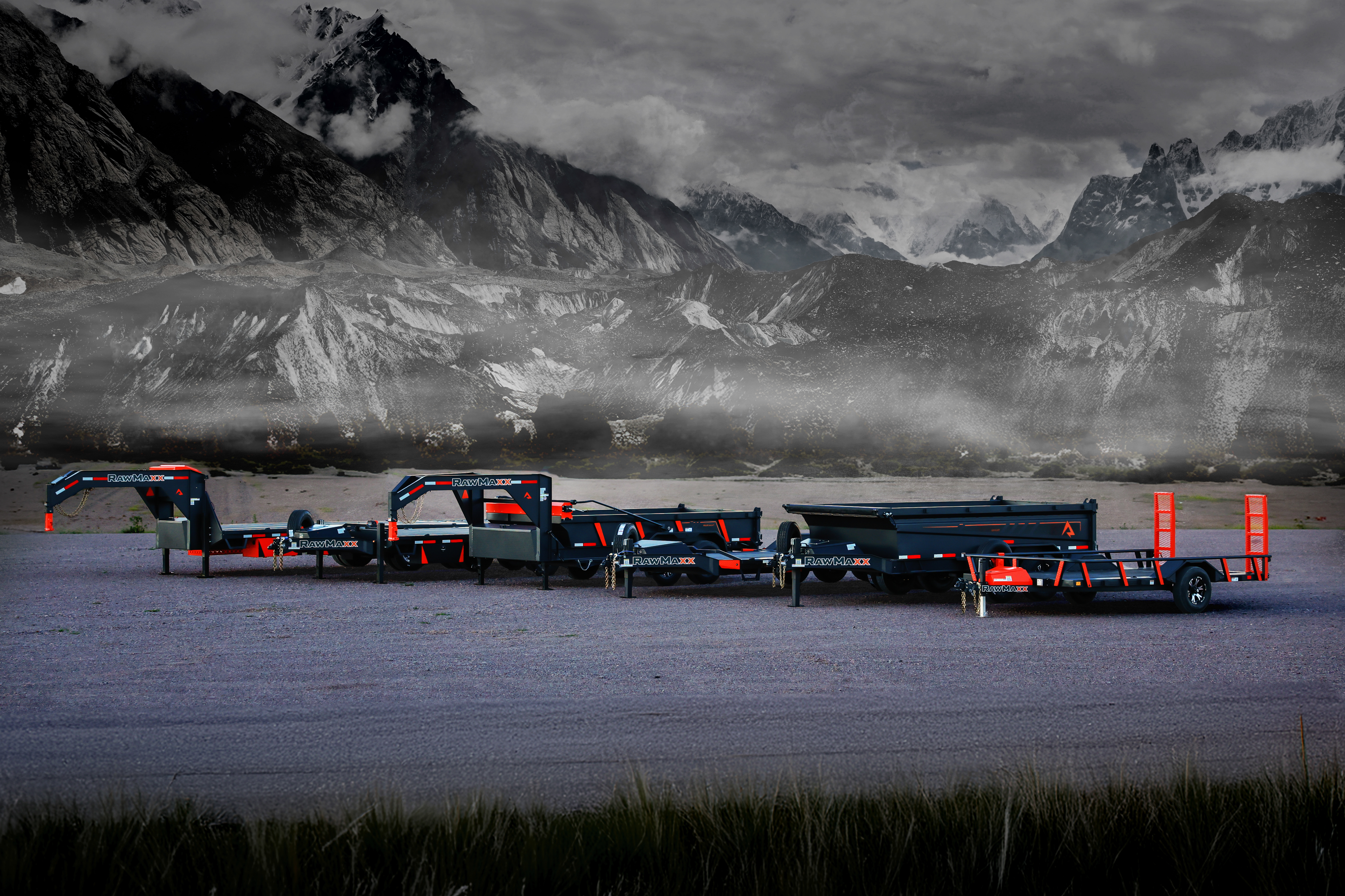 A lineup of heavy-duty RawMaxx trailers, including gooseneck, utility, dump, and equipment trailers, showcased against a dramatic mountain backdrop. Ideal for hauling vehicles, equipment, and materials A lineup of heavy-duty RawMaxx trailers, including gooseneck, utility, dump, and equipment trailers, showcased against a dramatic mountain backdrop. Ideal for hauling vehicles, equipment, and materials