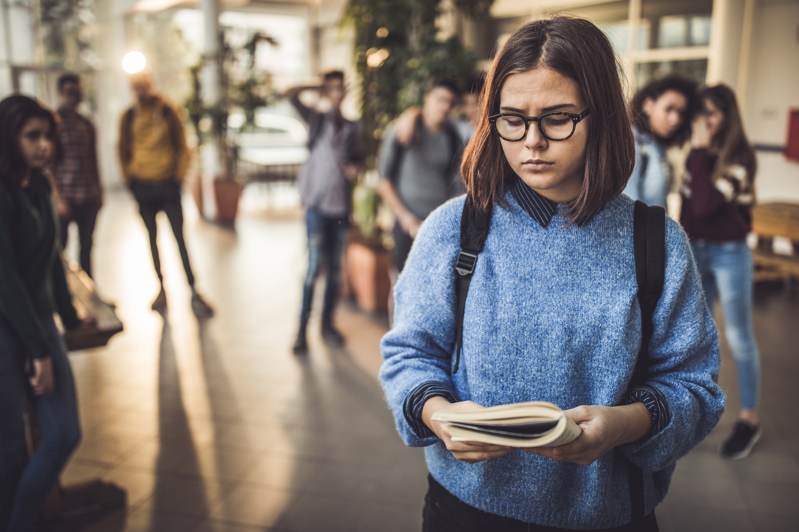 Girl in school feeling judged from social anxiety