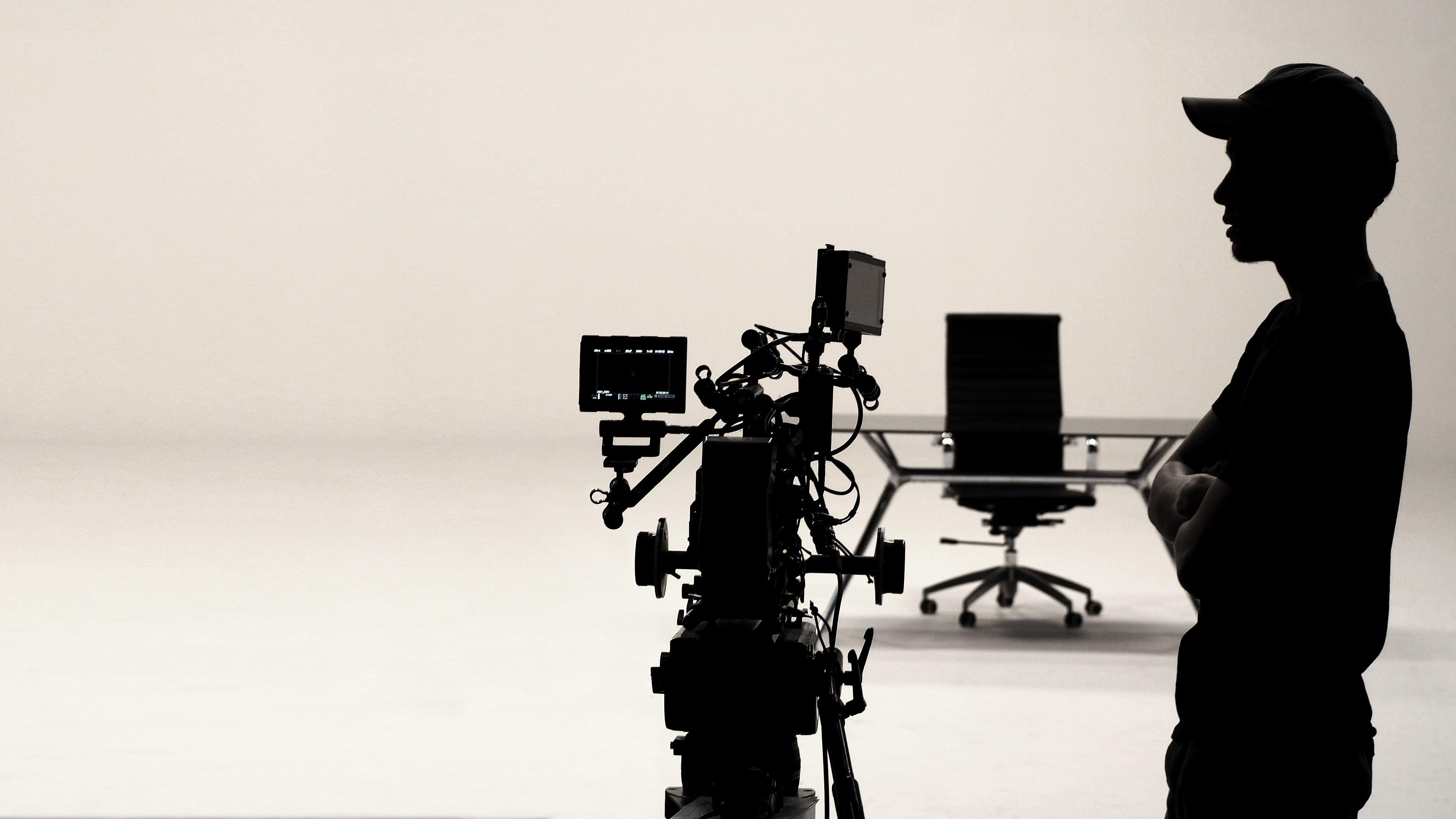 Silhouettes of a film production crew on set, highlighting teamwork, planning, and focused video marketing execution. Silhouettes of a film production crew on set, highlighting teamwork, planning, and focused video marketing execution.