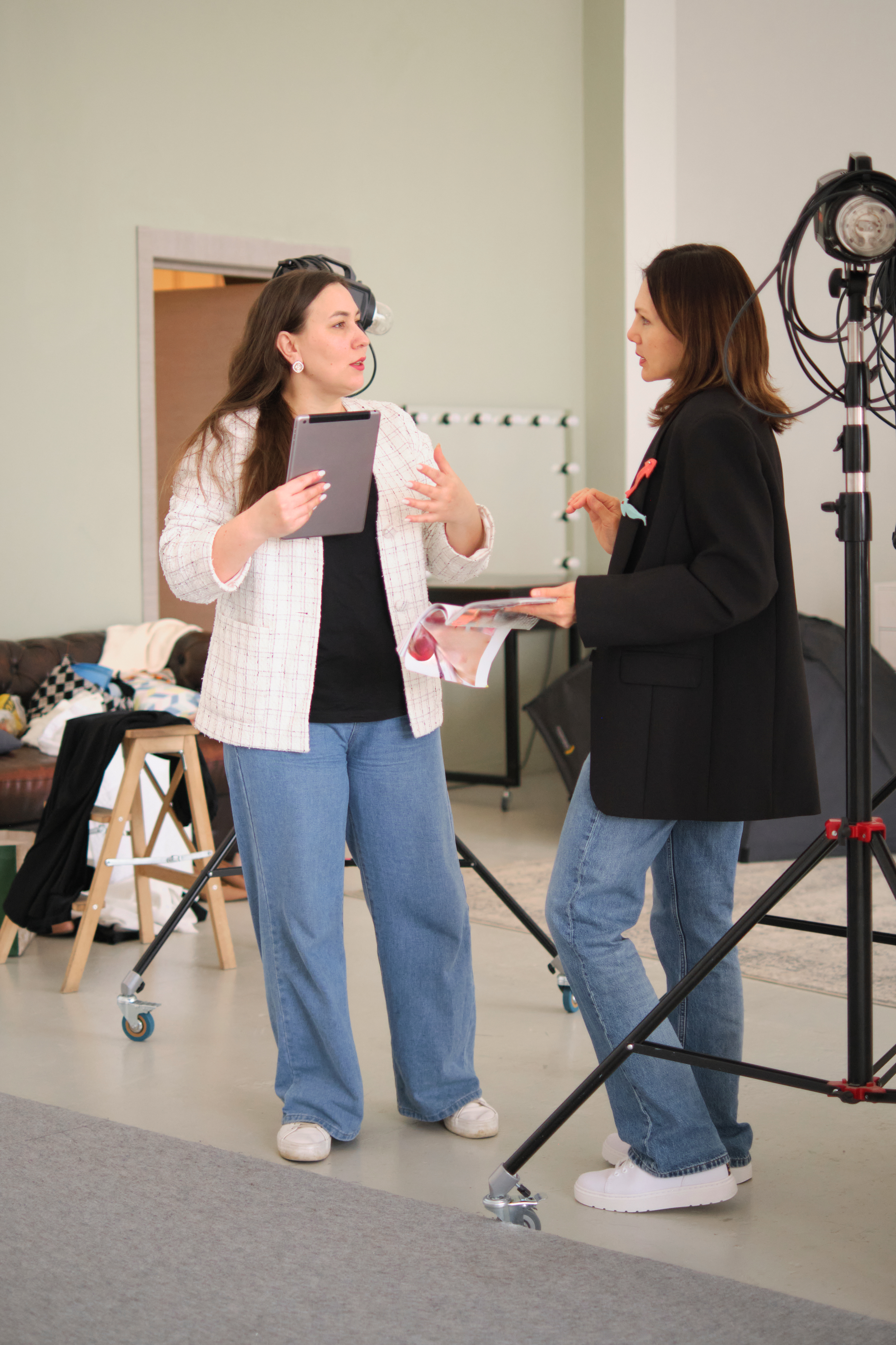 Two creative professionals discussing content strategy in a bright studio space, emphasizing clear and purposeful planning Two creative professionals discussing content strategy in a bright studio space, emphasizing clear and purposeful planning
