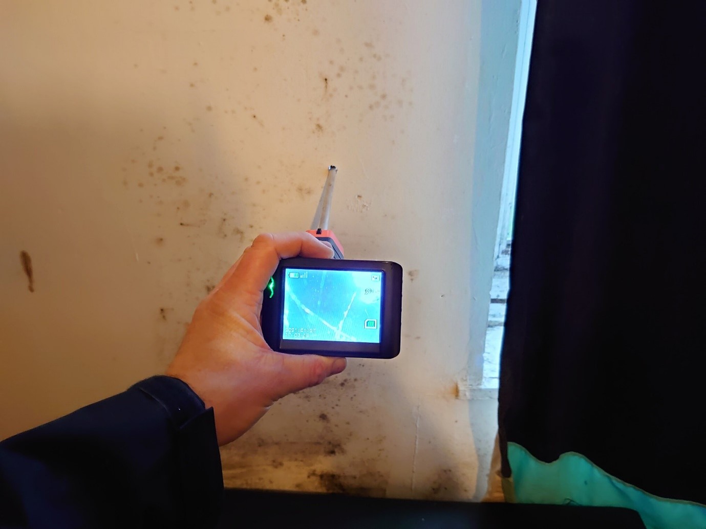 Borescope inspection in the same location confirming voids in the Mansard roof insulation