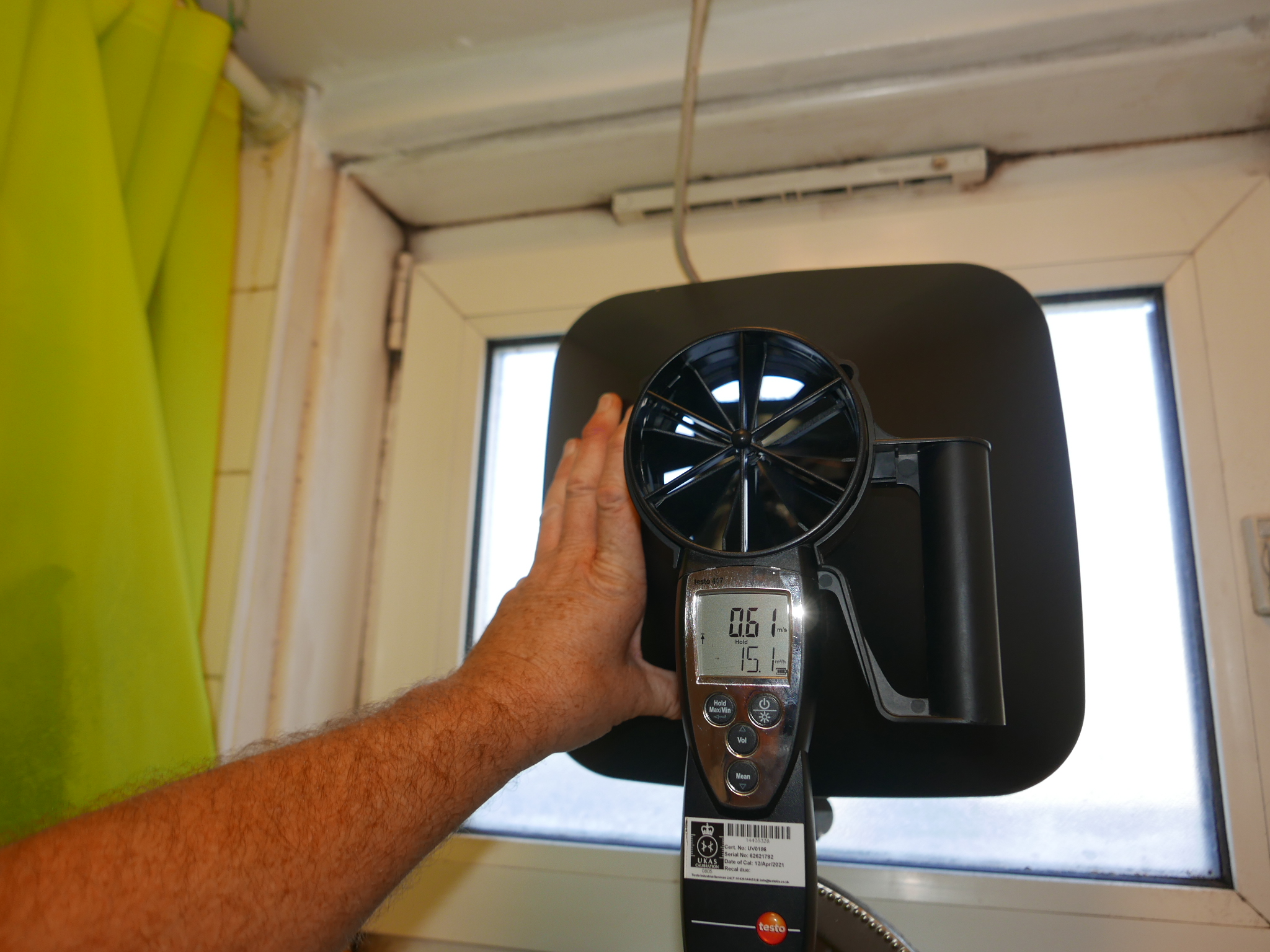 Testing extractor fan with an anemometer