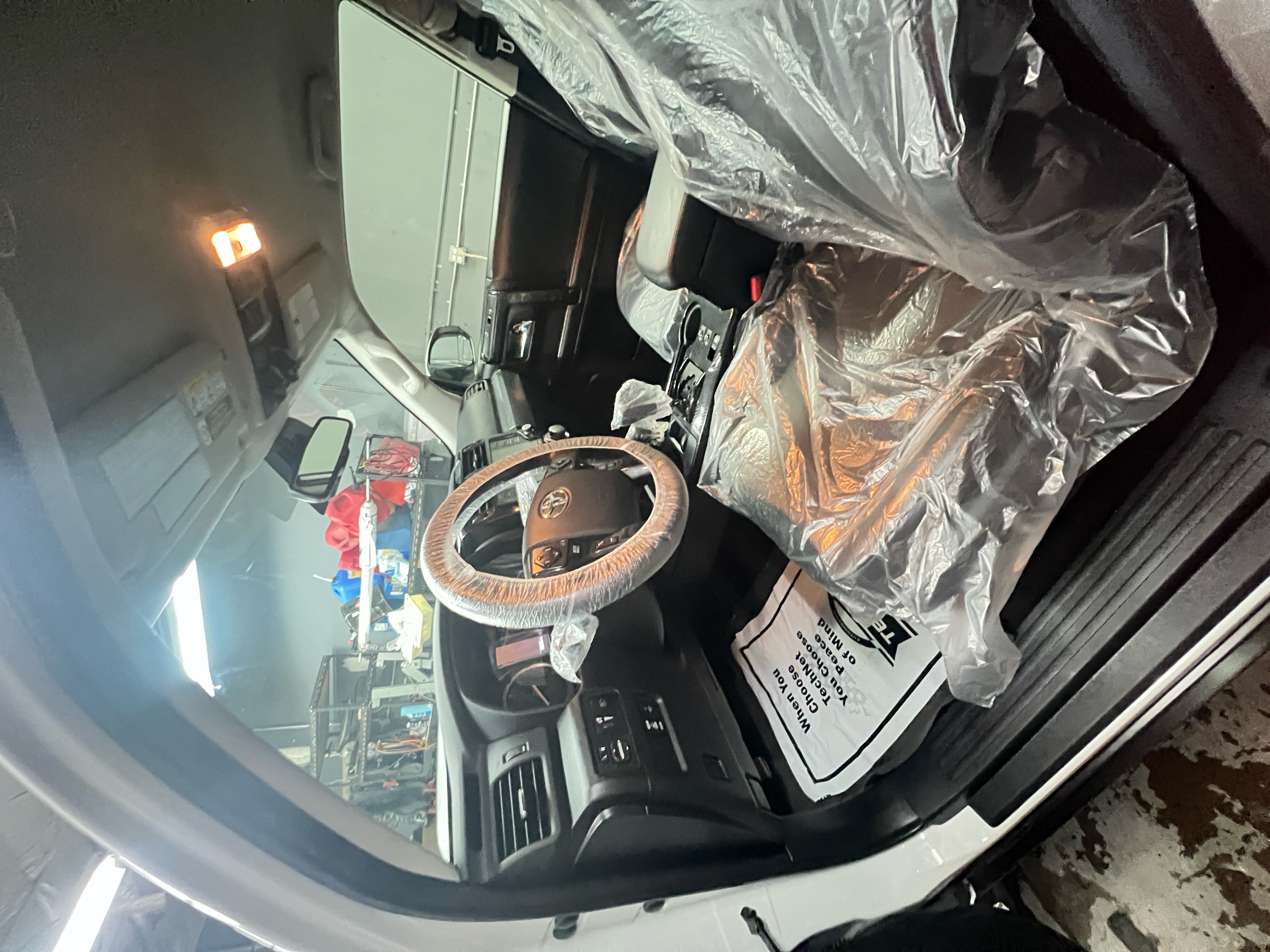 A professional technician deep cleans the interior of a fleet van, using a vacuum and specialized tools to remove dirt and debris. A professional technician deep cleans the interior of a fleet van, using a vacuum and specialized tools to remove dirt and debris.