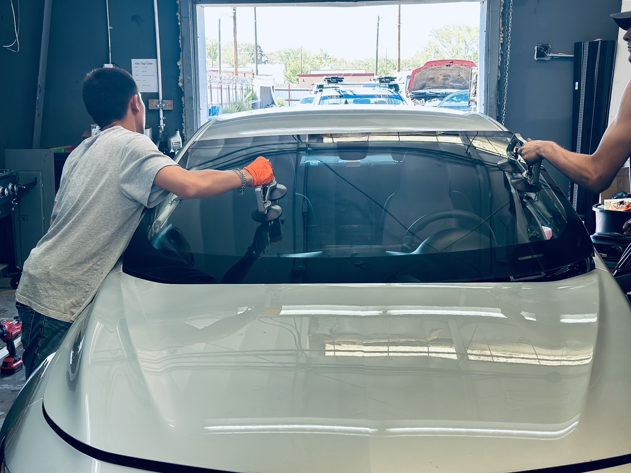 A technician injects resin into a small chip on a fleet truck’s windshield, using industry-standard repair equipment. A technician injects resin into a small chip on a fleet truck’s windshield, using industry-standard repair equipment.