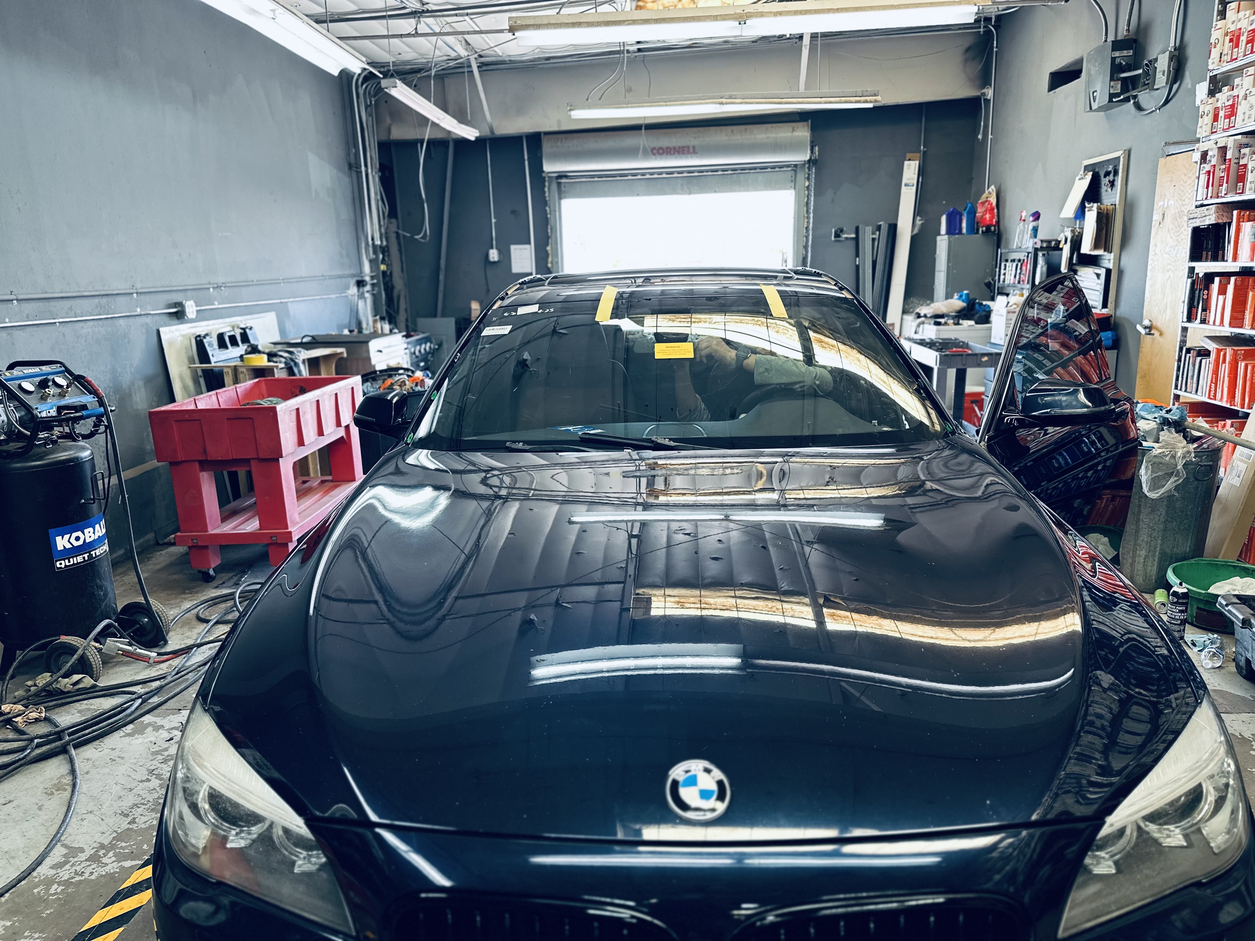A technician uses a UV light to cure the resin in a repaired windshield chip, followed by gentle polishing for a smooth finish. A technician uses a UV light to cure the resin in a repaired windshield chip, followed by gentle polishing for a smooth finish.