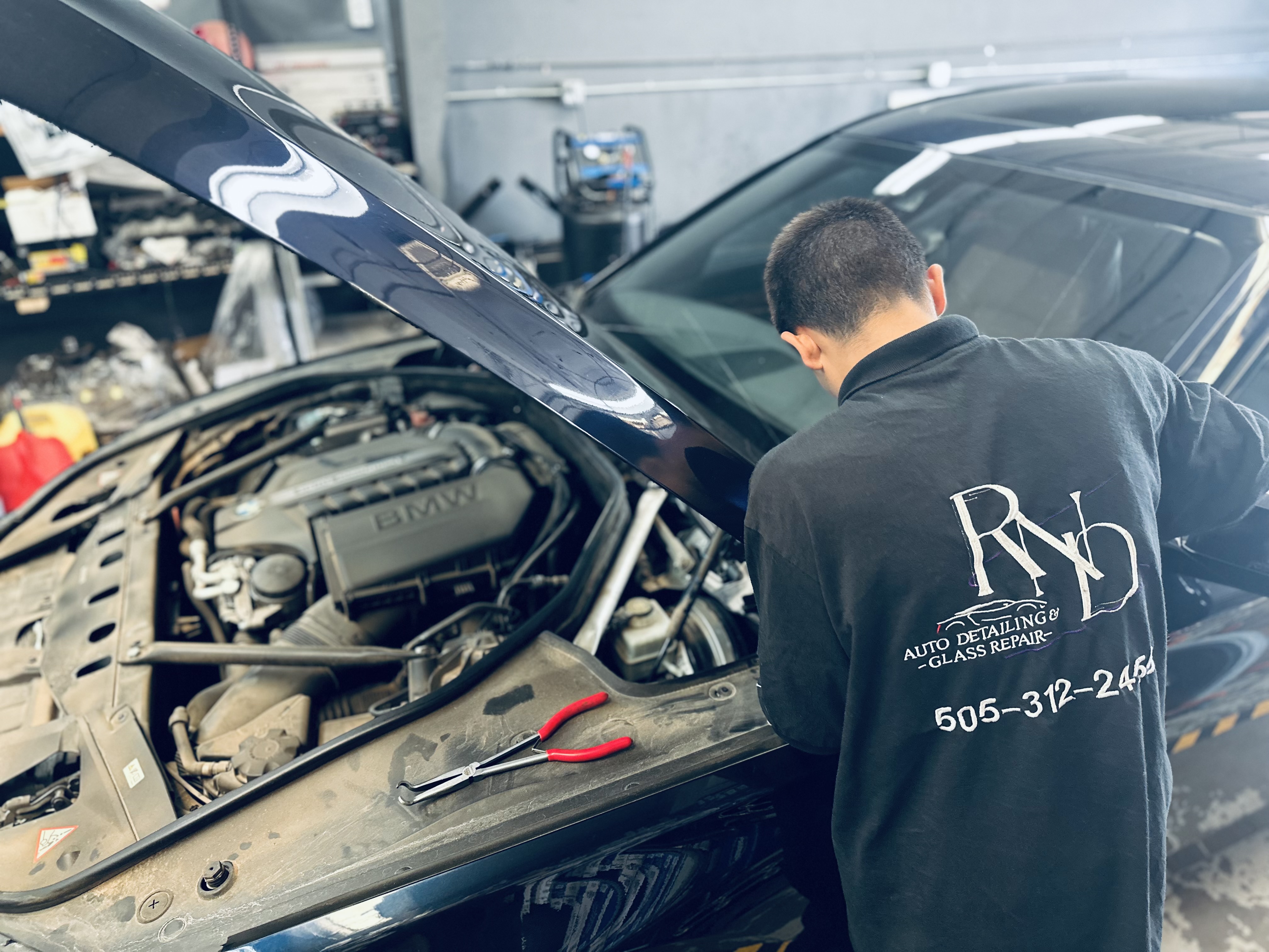 A smiling driver sits behind the wheel of a freshly detailed fleet vehicle with a new windshield, ready for the next job. A smiling driver sits behind the wheel of a freshly detailed fleet vehicle with a new windshield, ready for the next job.
