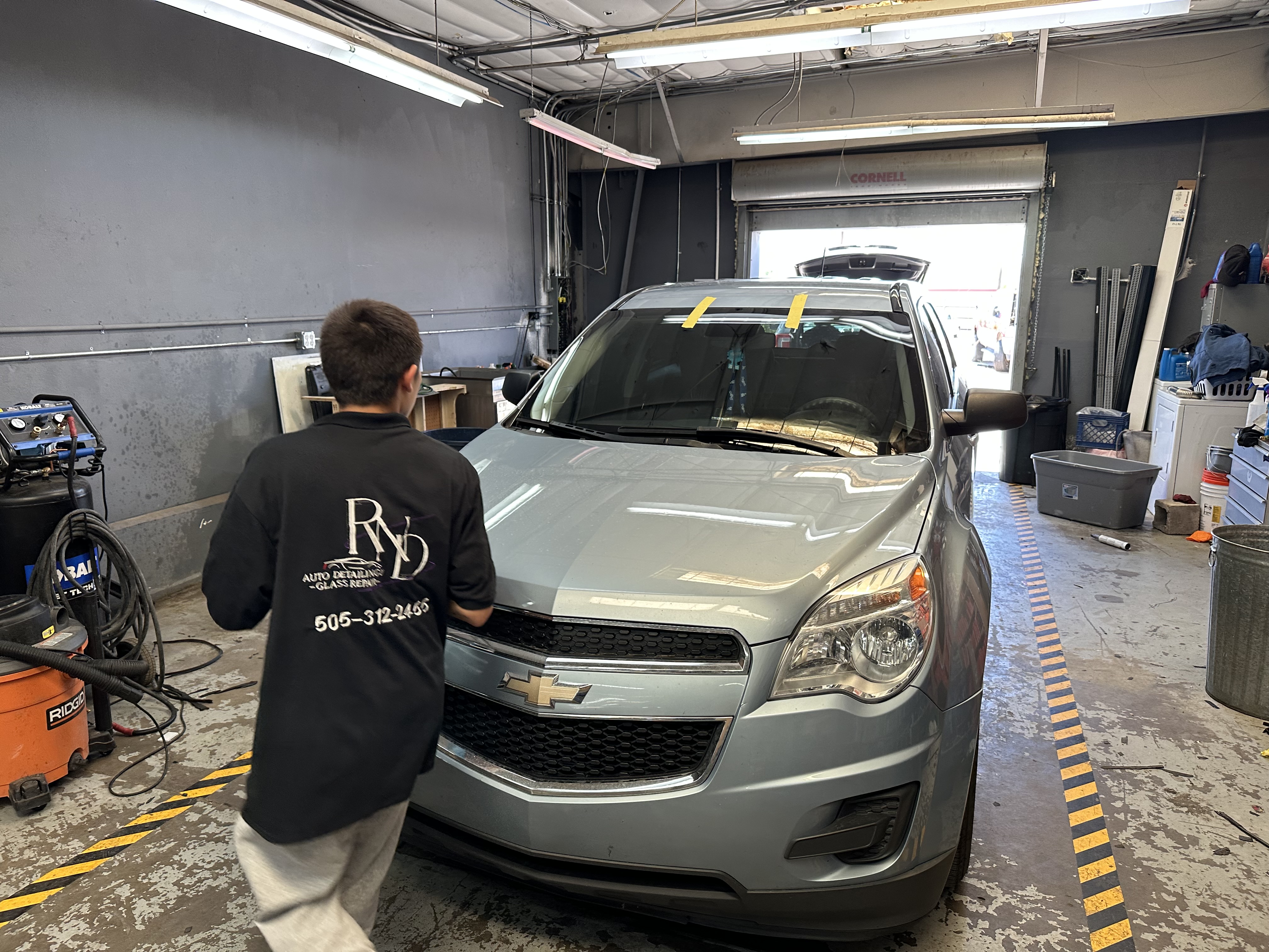 A fleet manager reviews maintenance and detailing records with a service advisor at RND Auto Detailing and Glass Repair LLC. A fleet manager reviews maintenance and detailing records with a service advisor at RND Auto Detailing and Glass Repair LLC.