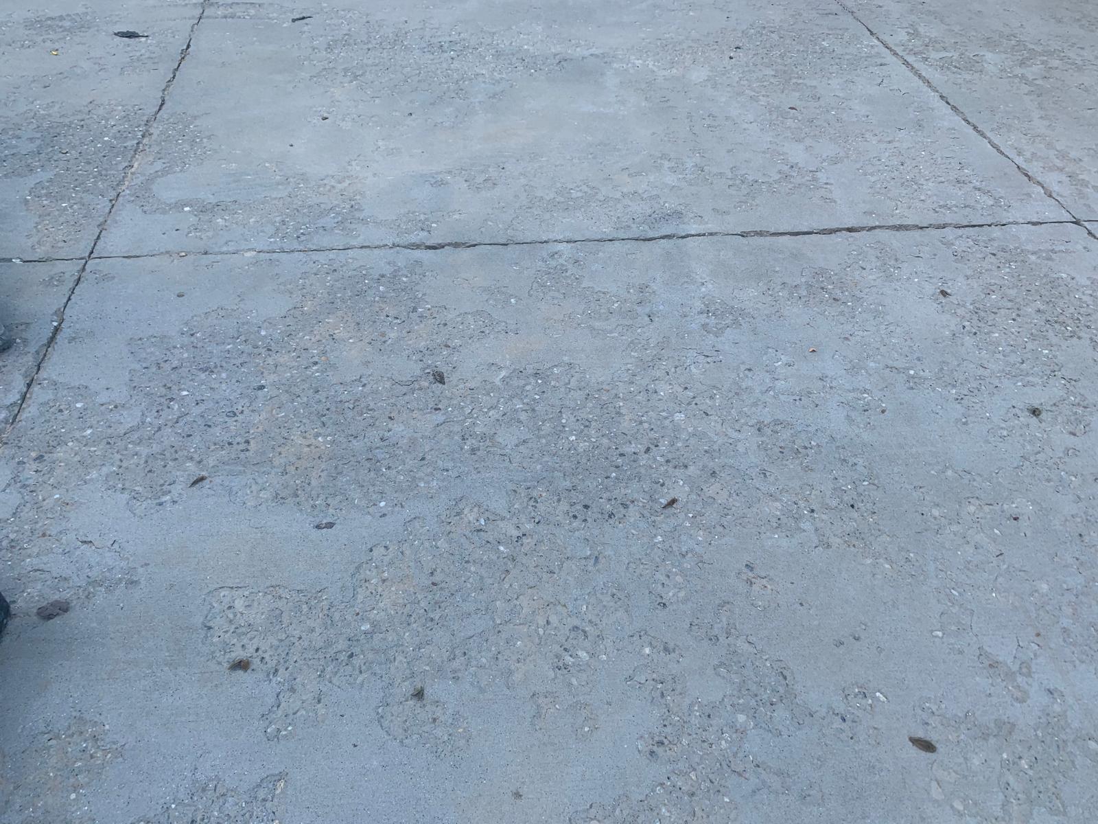 Concrete damaged by salt, de-icing, salt, winter, icy driveway, spalling
