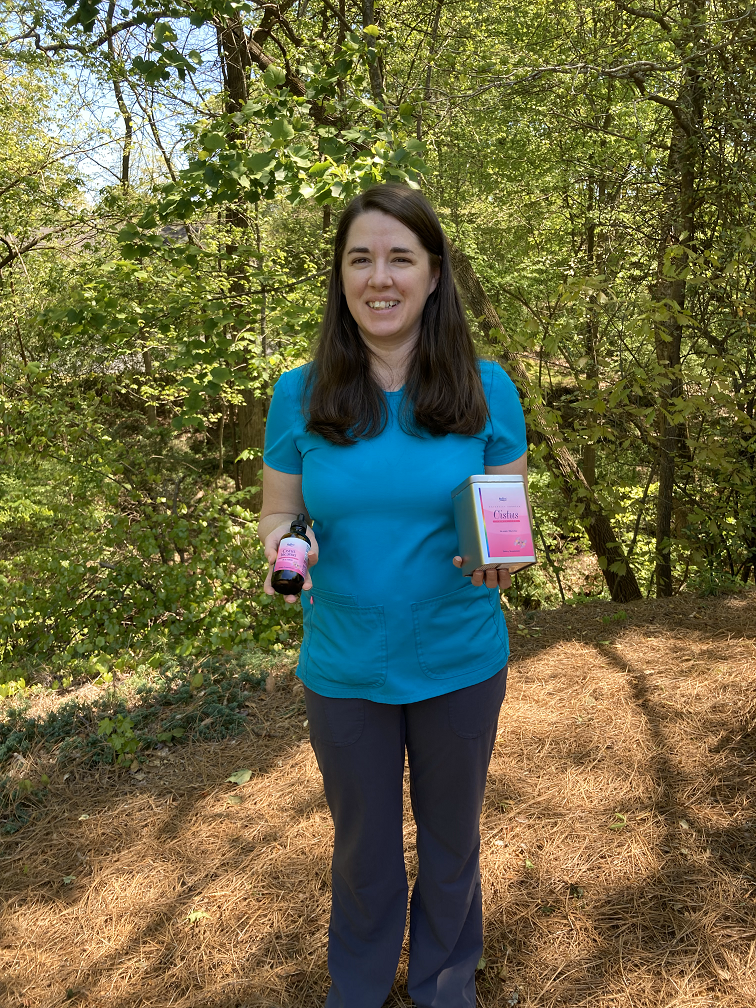 Person holding Cistus Incanus Tea.