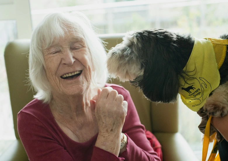 A senior woman enjoys cuddles with her dog with her in-home caregiver provided by Preferred Care at Home, through Sumner In-Home Care A senior woman enjoys cuddles with her dog with her in-home caregiver provided by Preferred Care at Home, through Sumner In-Home Care