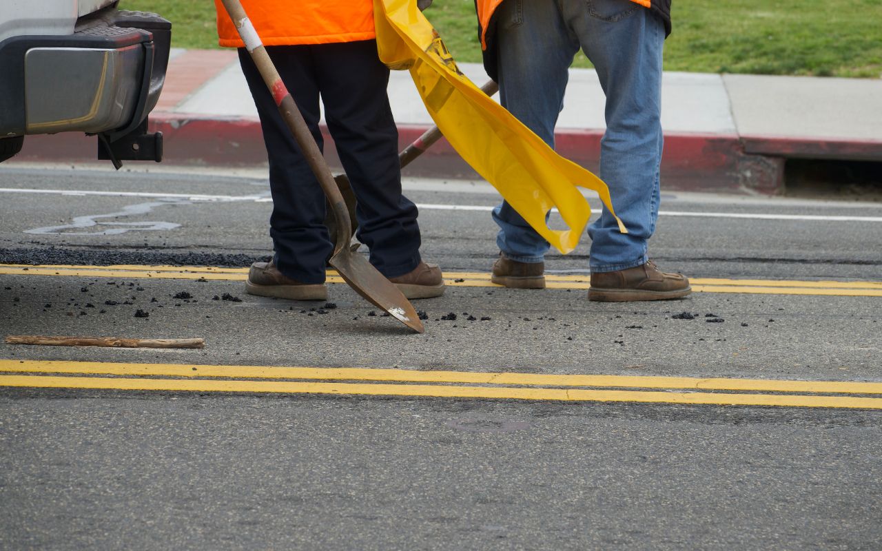 Cleaning a pothole before repair