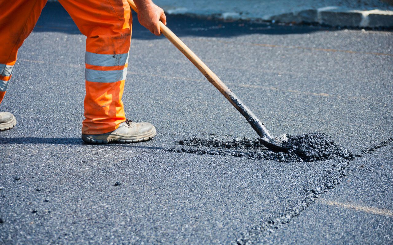 Asphalt Sealcoating Why It's Essential - Learn More