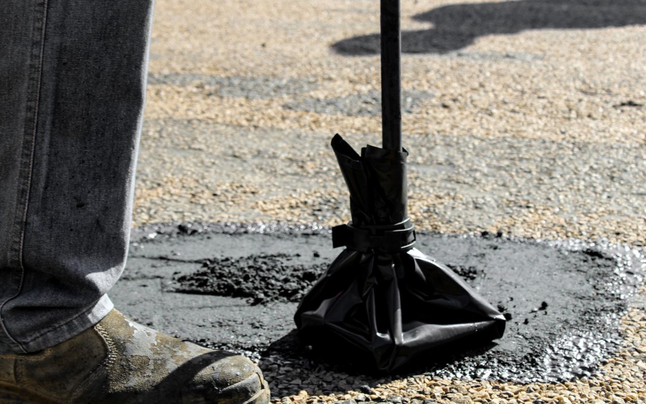 Pothole patching on a commercial asphalt surface Pothole patching on a commercial asphalt surface
