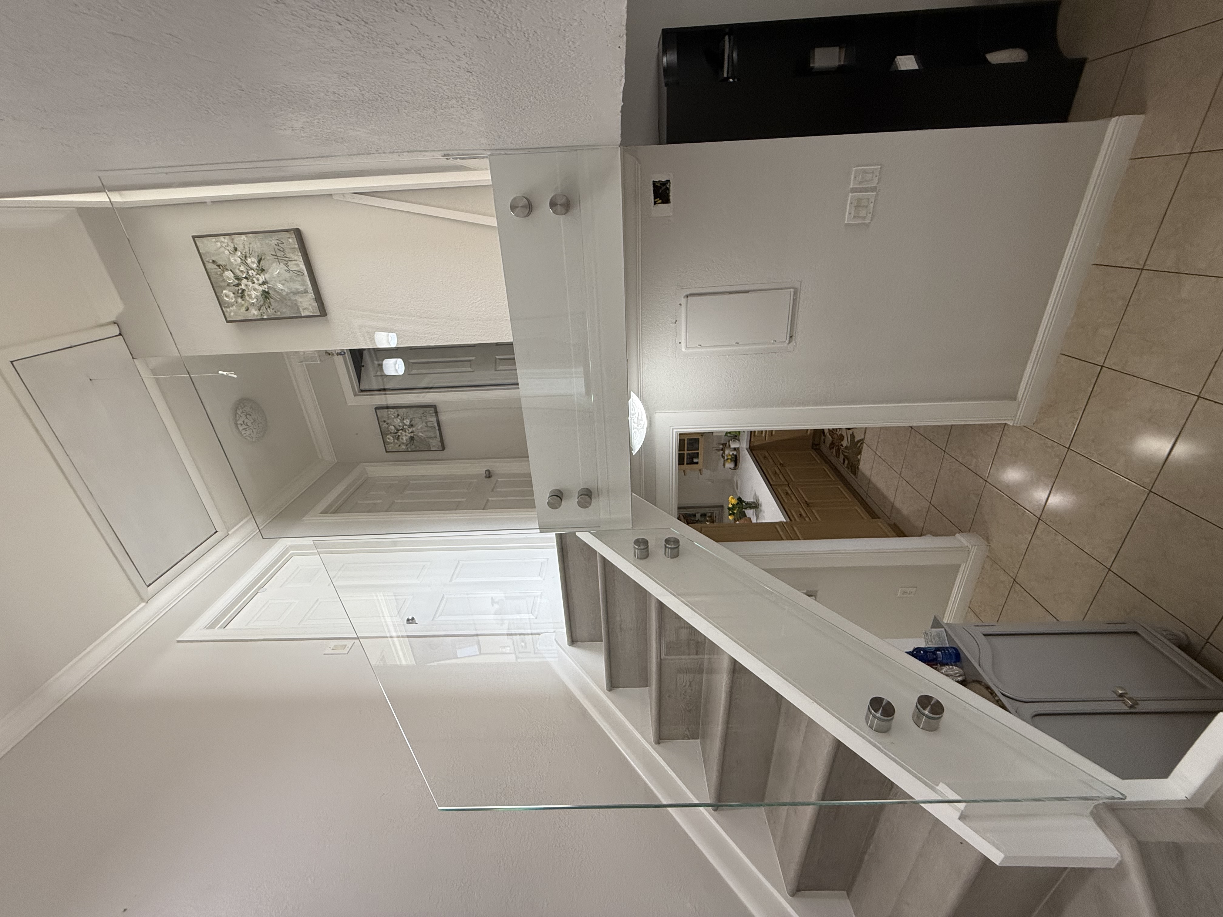 Stair glass railing preserving light and sight lines
