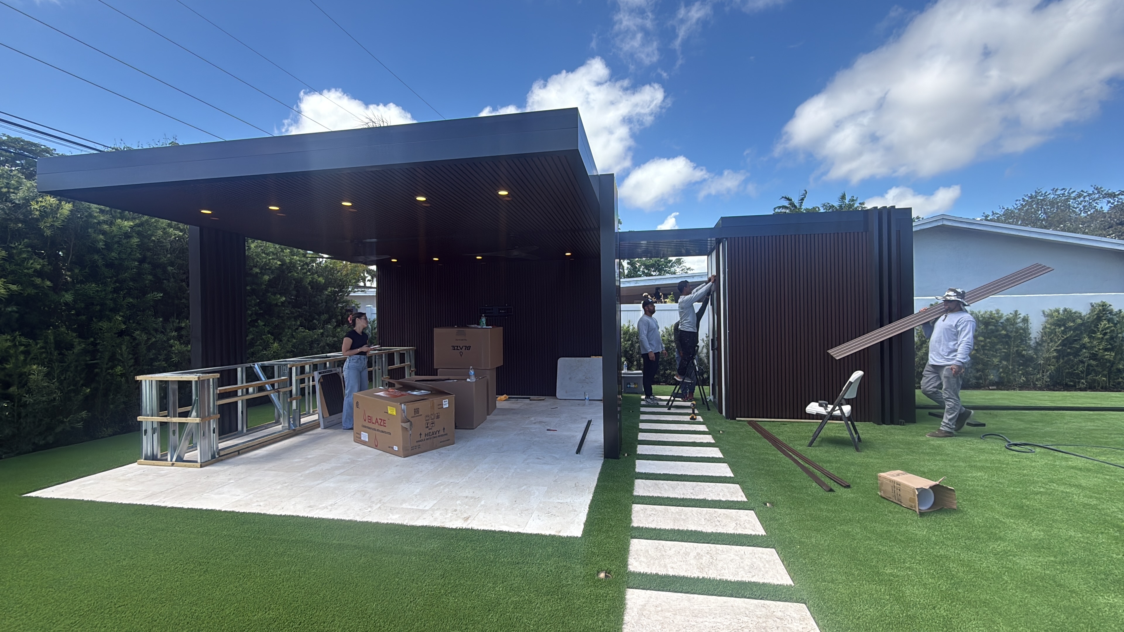 Aluminum outdoor structure with ceiling finish and integrated lighting
