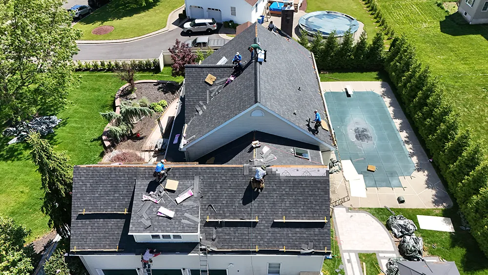 Roofing detail showing skylight flashing transition and clean install workmanship in New Jersey