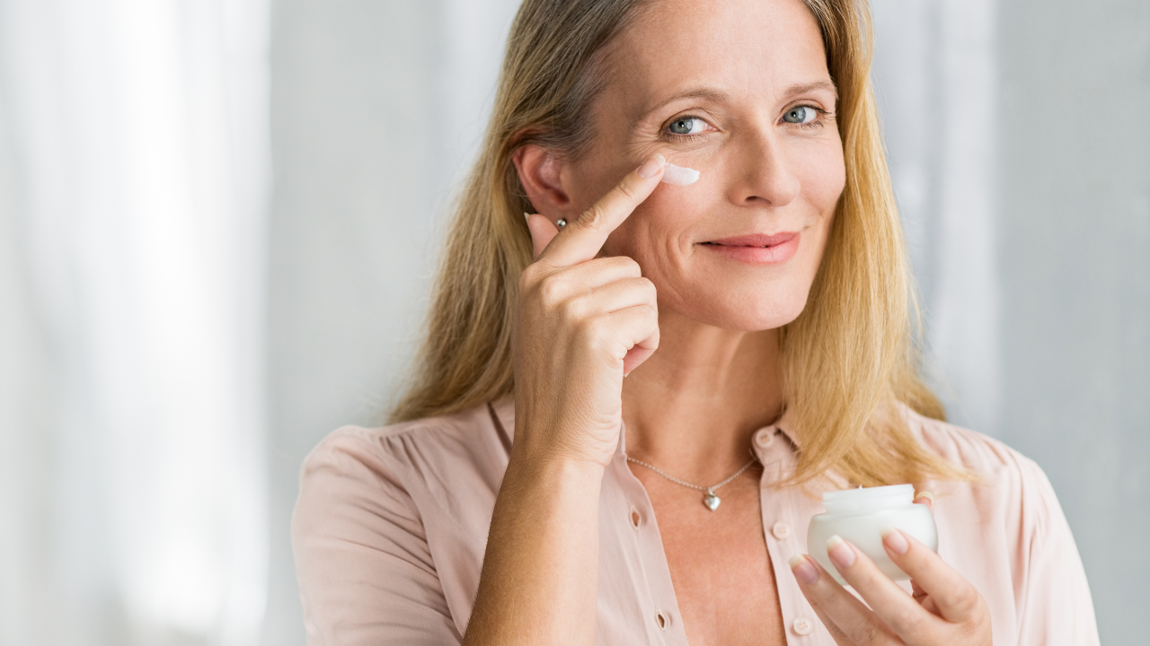 Woman Over 50 Applying Moisturizer Woman Over 50 Applying Moisturizer