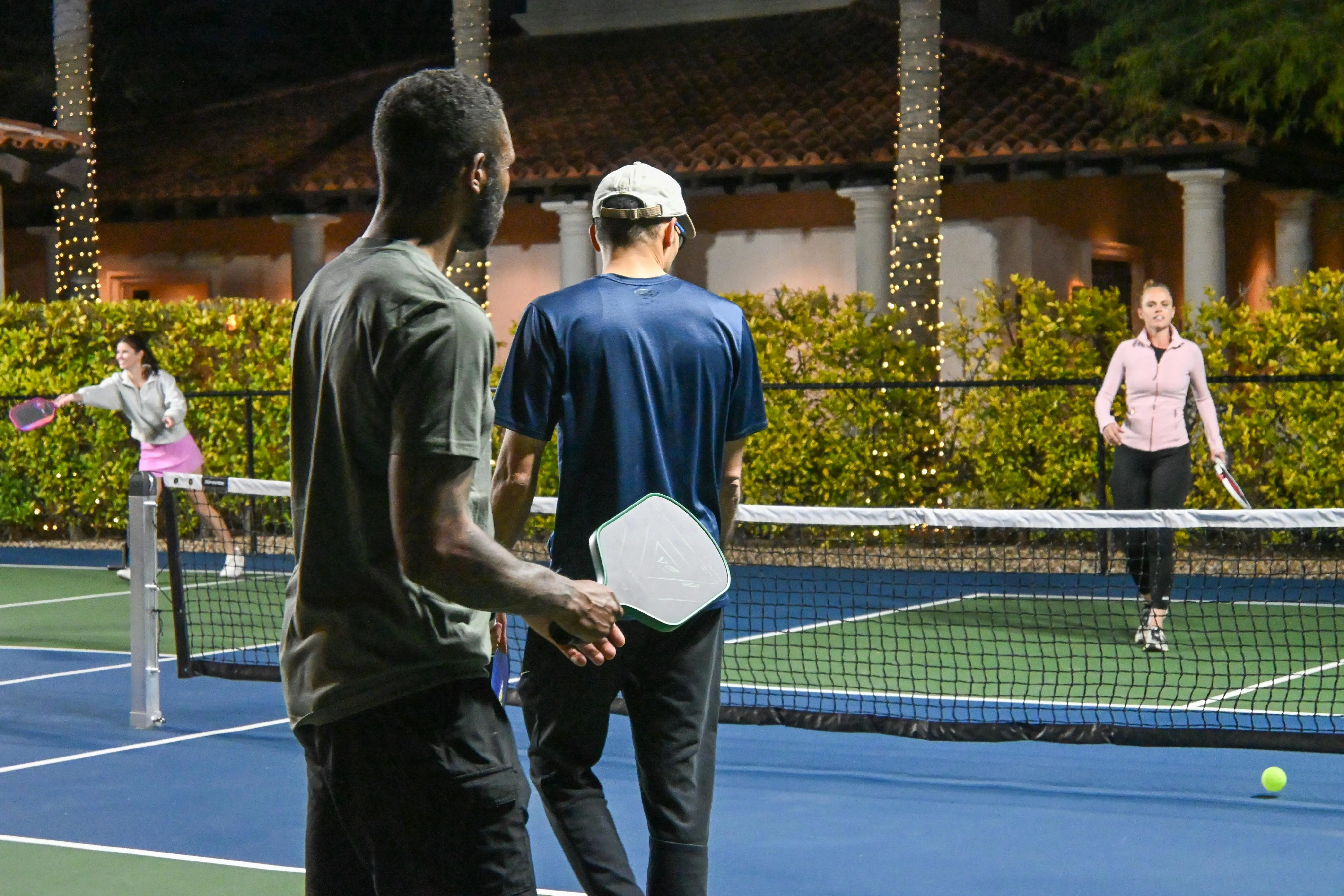 image of friends playing in a residential pickleball courts image of friends playing in a residential pickleball courts