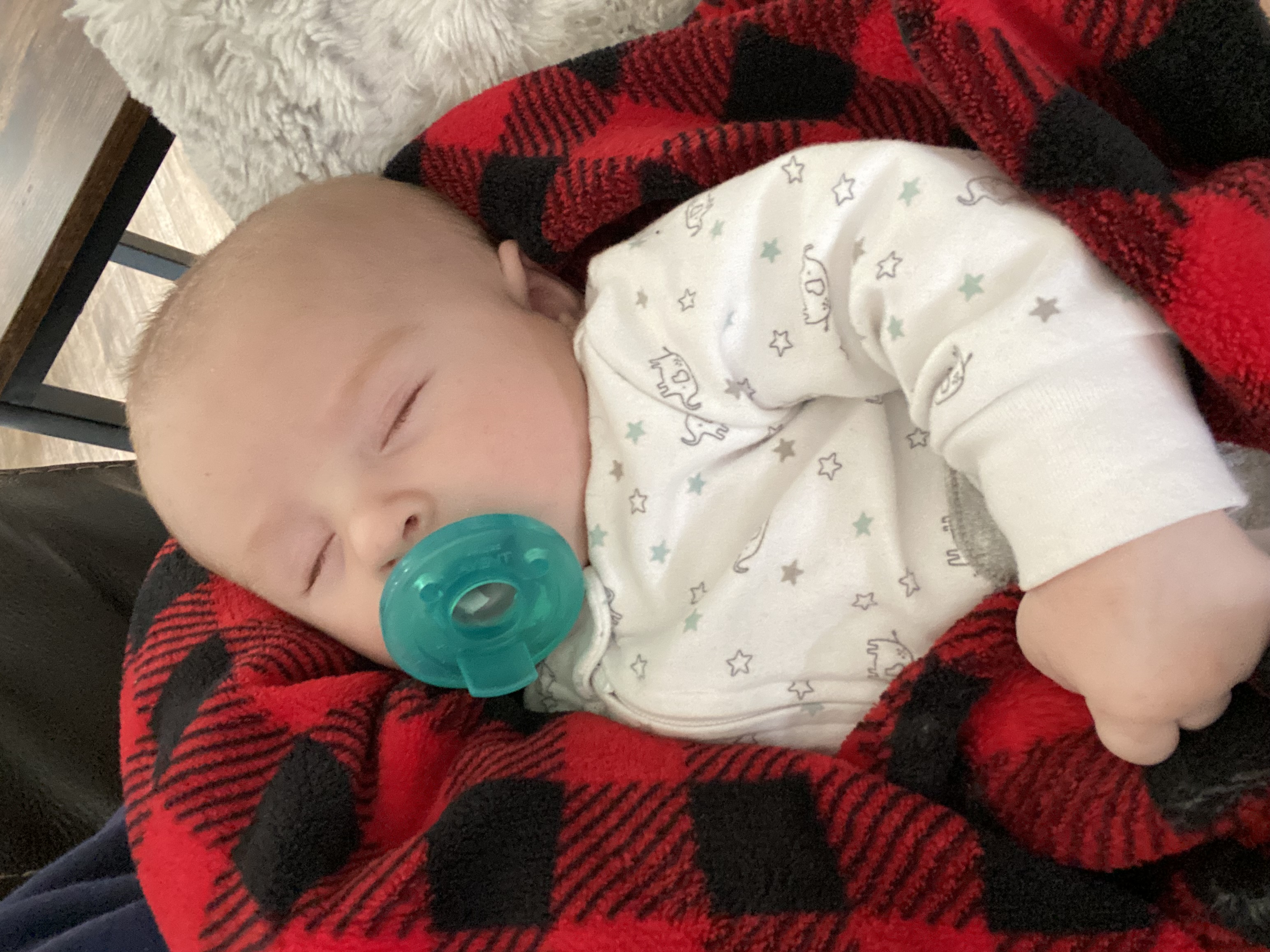 Sleeping Baby snuggling mom 