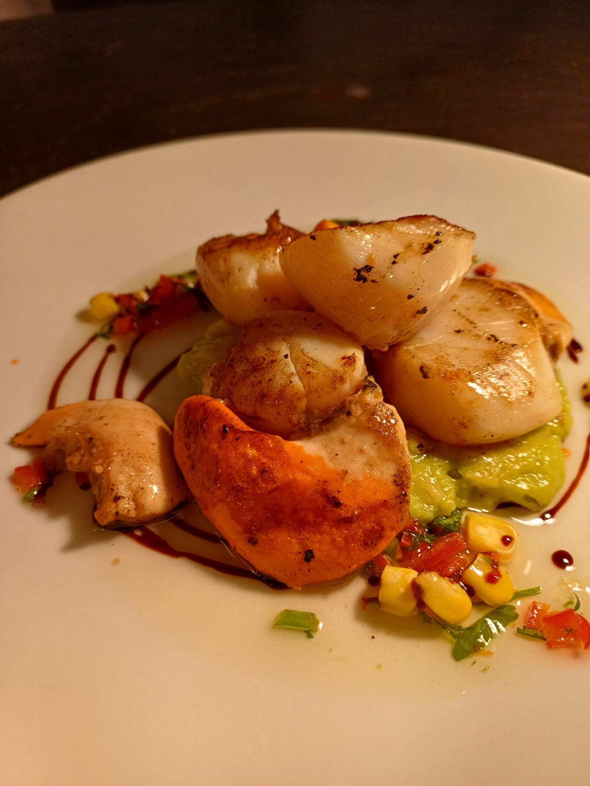 A starter plate of pan fried scallops A starter plate of pan fried scallops