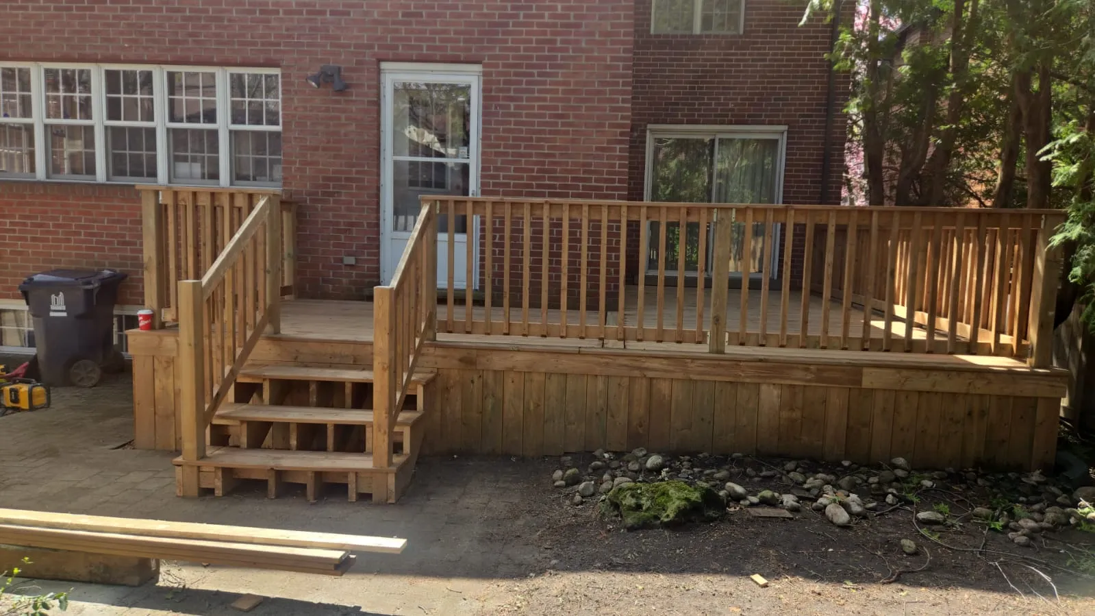 Completed deck rebuild in Etobicoke with safe stairs and new wood railings Completed deck rebuild in Etobicoke with safe stairs and new wood railings