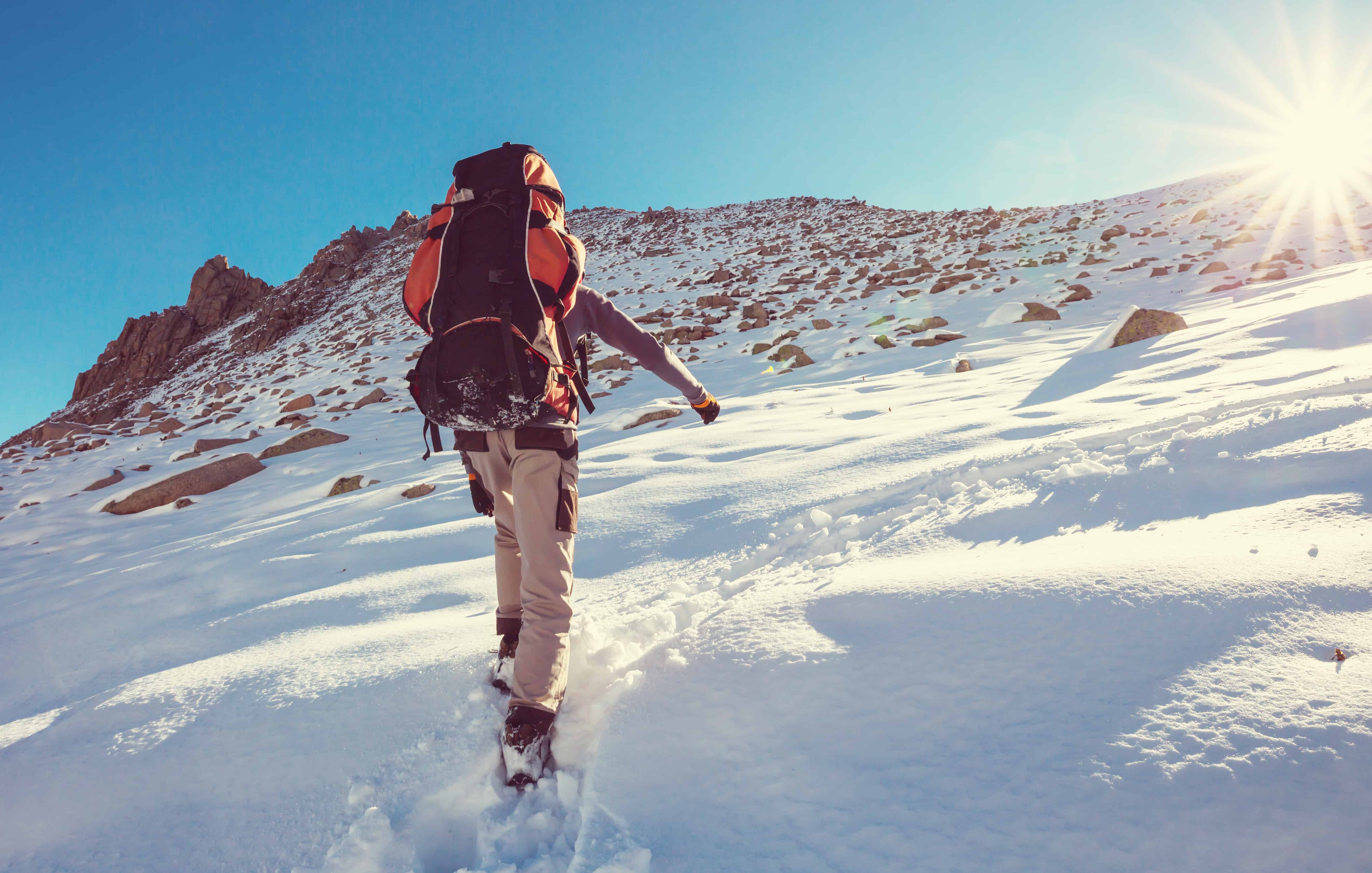 walking in snow with sun