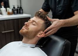 Client relaxing during a scalp massage and cleanse