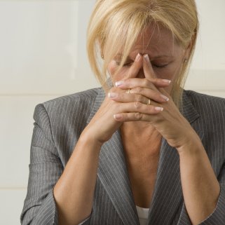 Woman in distress experiencing mood changes and hormonal imbalance during menopause.