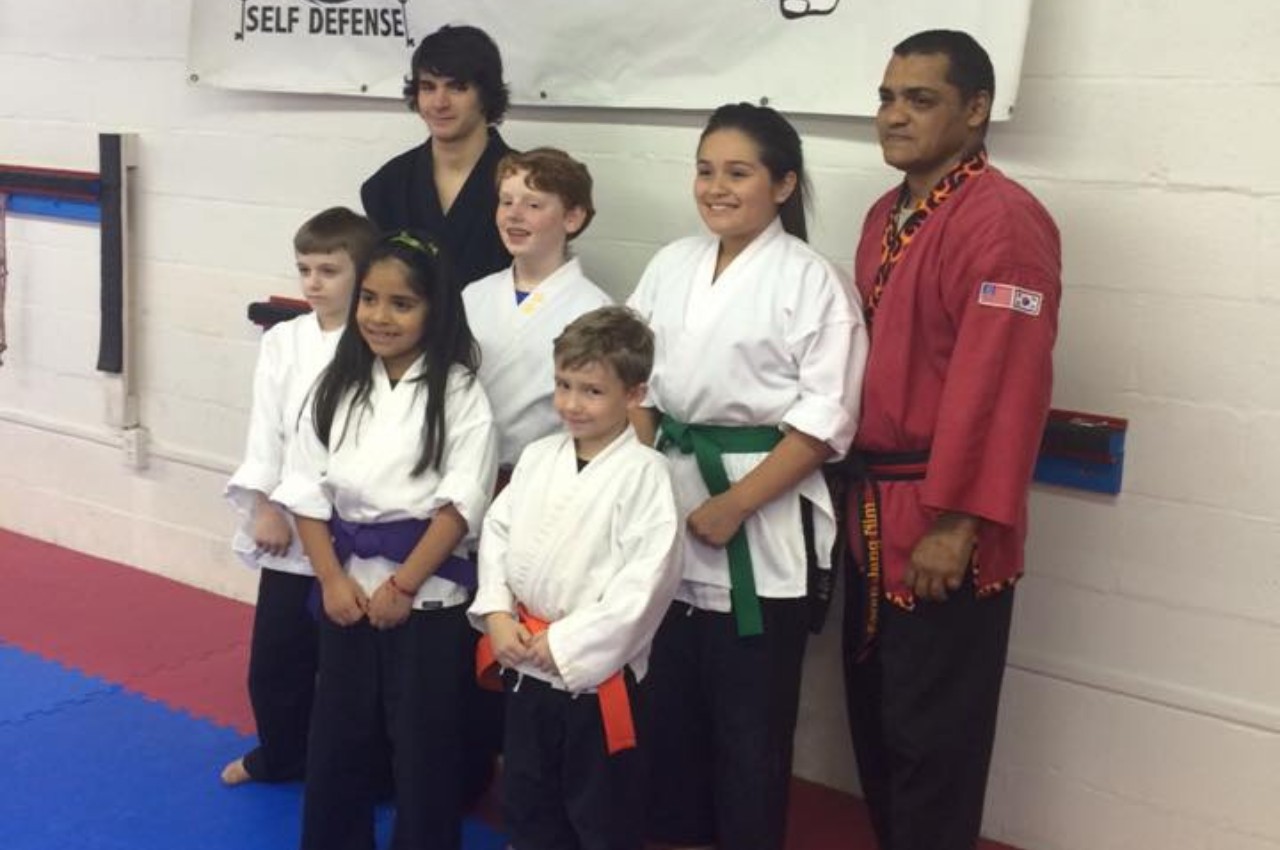 Martial arts instructor with kids