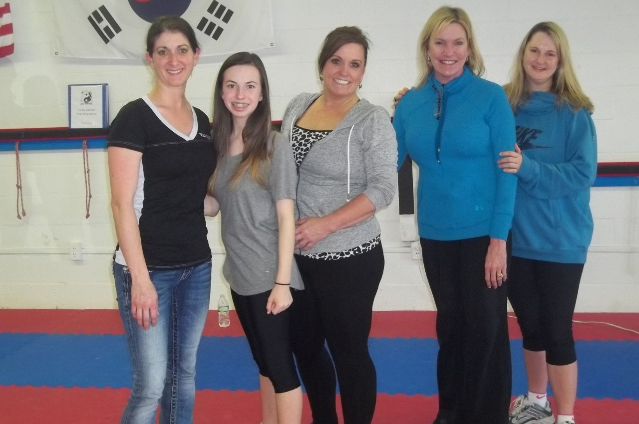 Martial arts instructor with kids