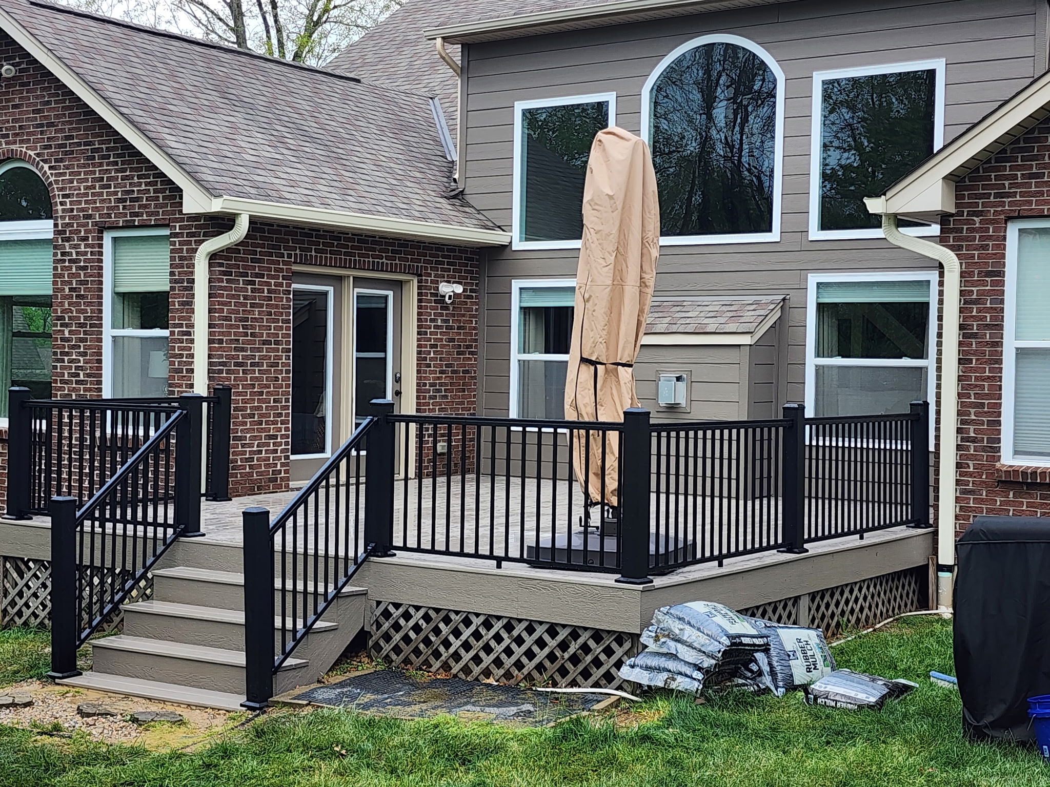 Gray PVC deck boards with black aluminum railing by TimberCo in the Dayton, Ohio area