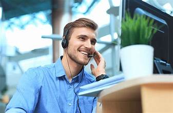 A person talking on the phone with an insurance agent, emphasizing the importance of communication and seeking clarity on coverage before renting a U-Haul truck for a move