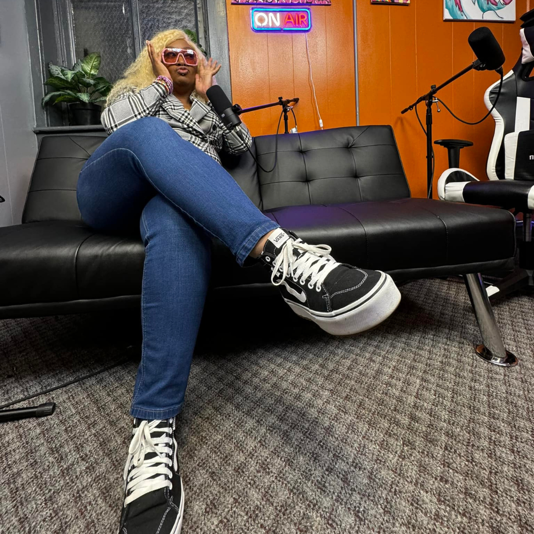 women sitting on a couch in a podcast studio about to go on air women sitting on a couch in a podcast studio about to go on air
