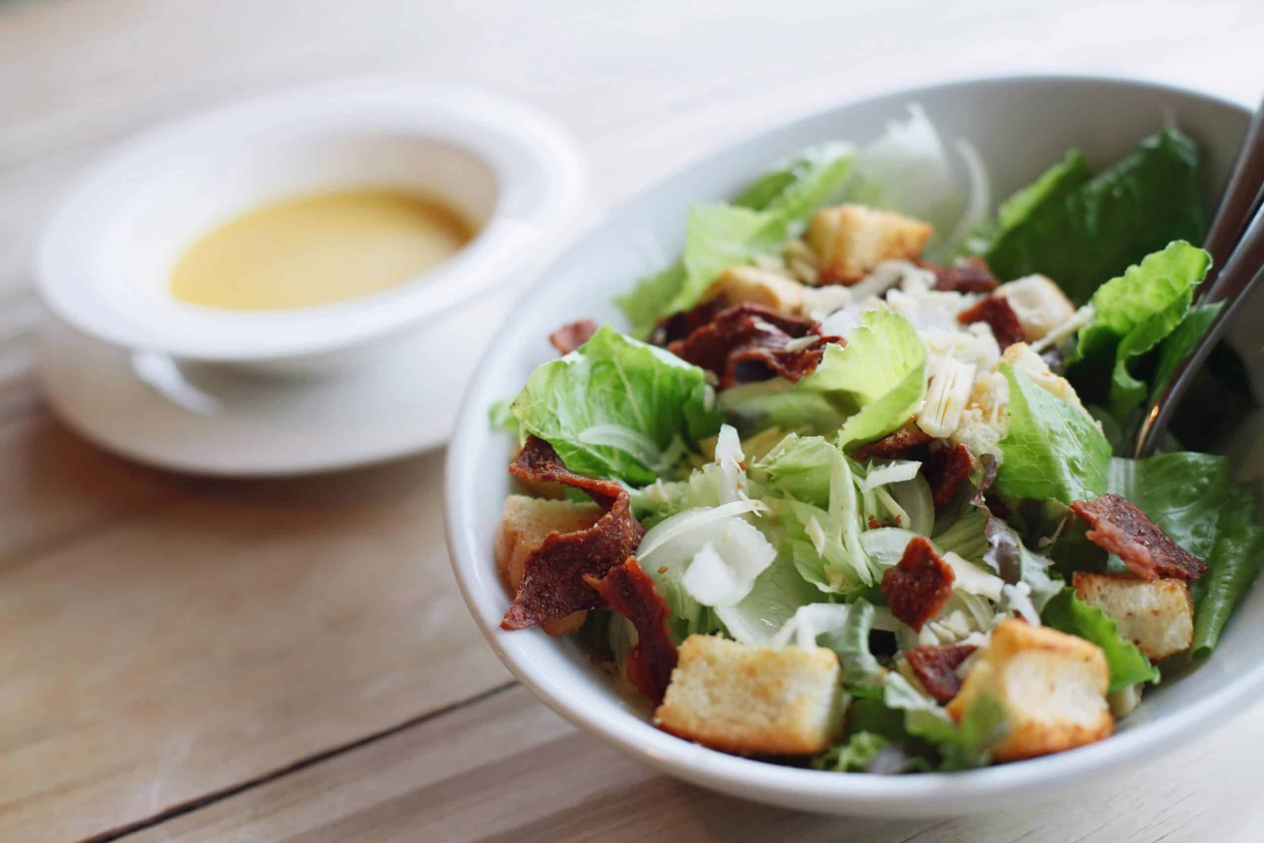 bowl of salad next to bowl of soup