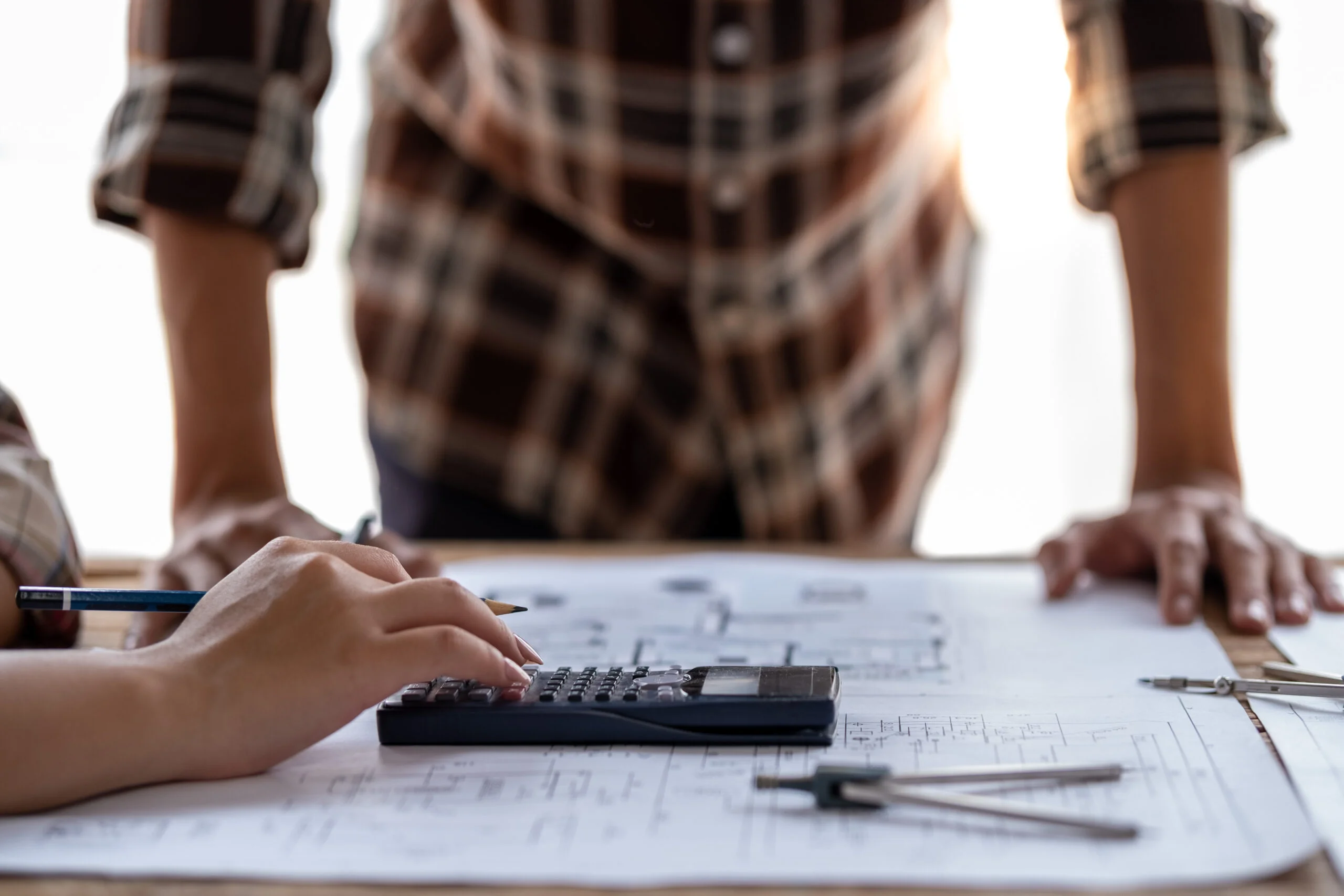  engineer and architect use calculator for calculate drawing design construction