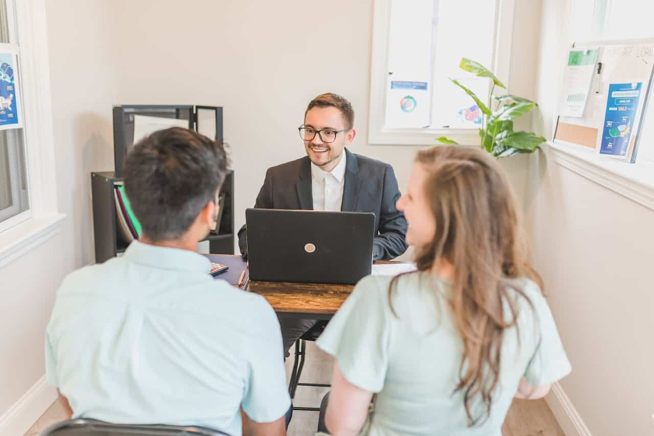 a couple working with a real estate professional