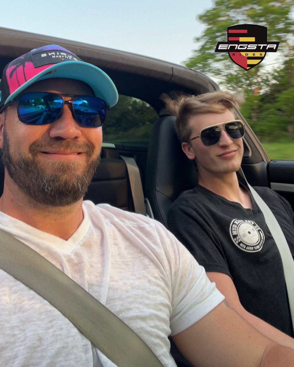 father and son driving with the targa top down father and son driving with the targa top down