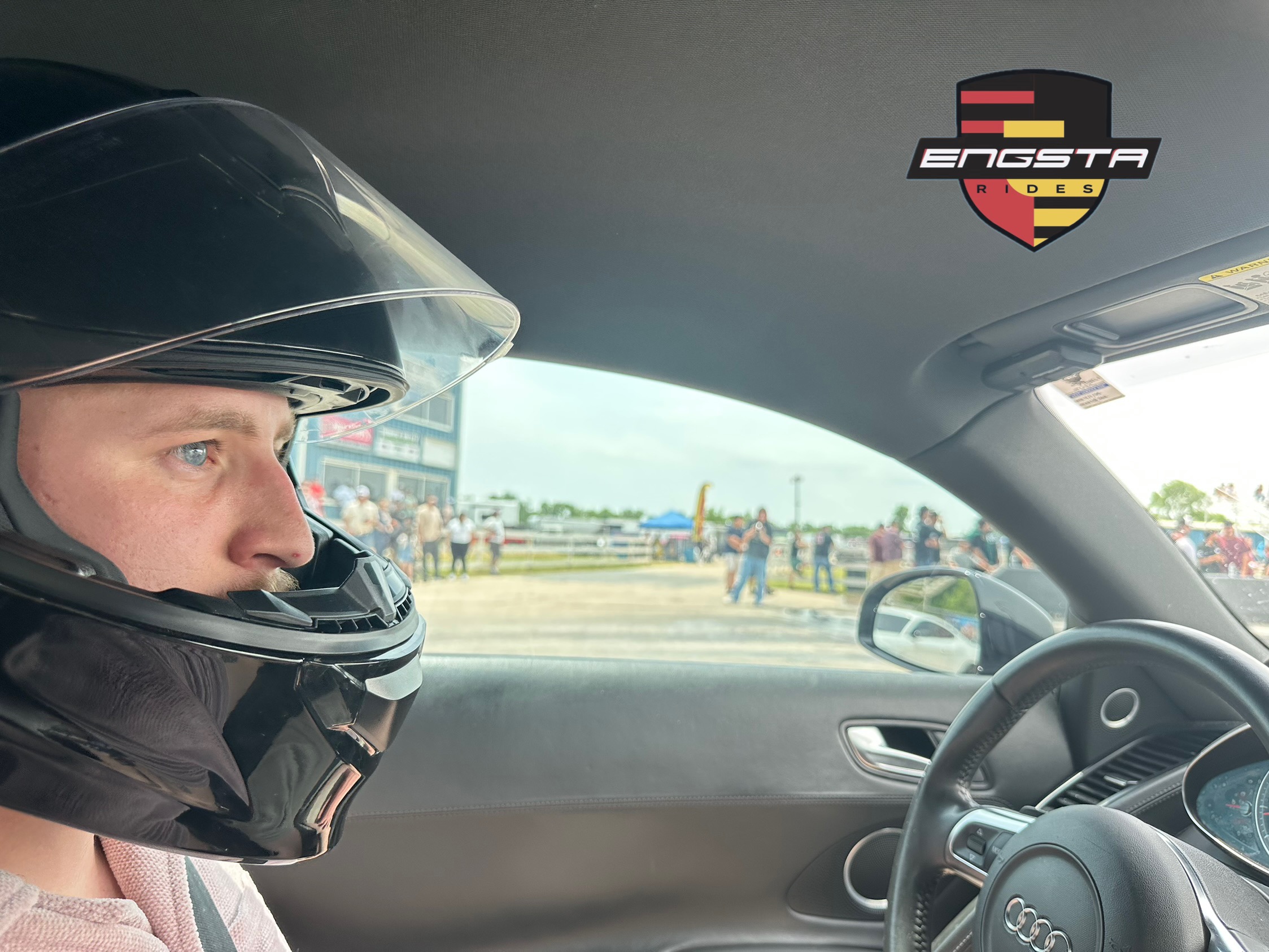 Max Engster sitting in his 2008 Audi R8 wearing a helmet ready to race Max Engster sitting in his 2008 Audi R8 wearing a helmet ready to race