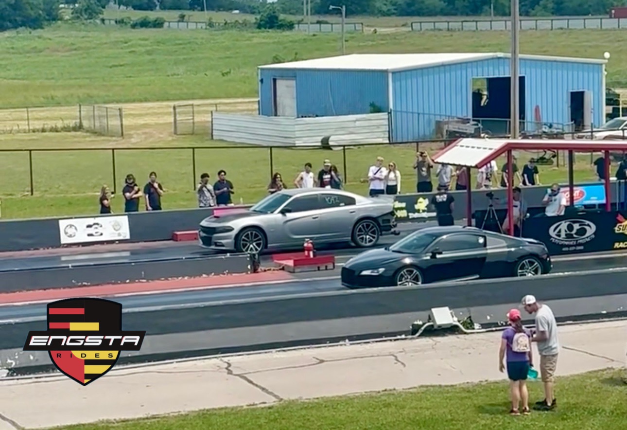 Audi R8 lined up against a tuned Dodge Charger at a drag strip Audi R8 lined up against a tuned Dodge Charger at a drag strip