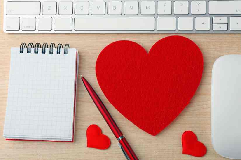 Computer Peripherals with Notebook and Red Hearts