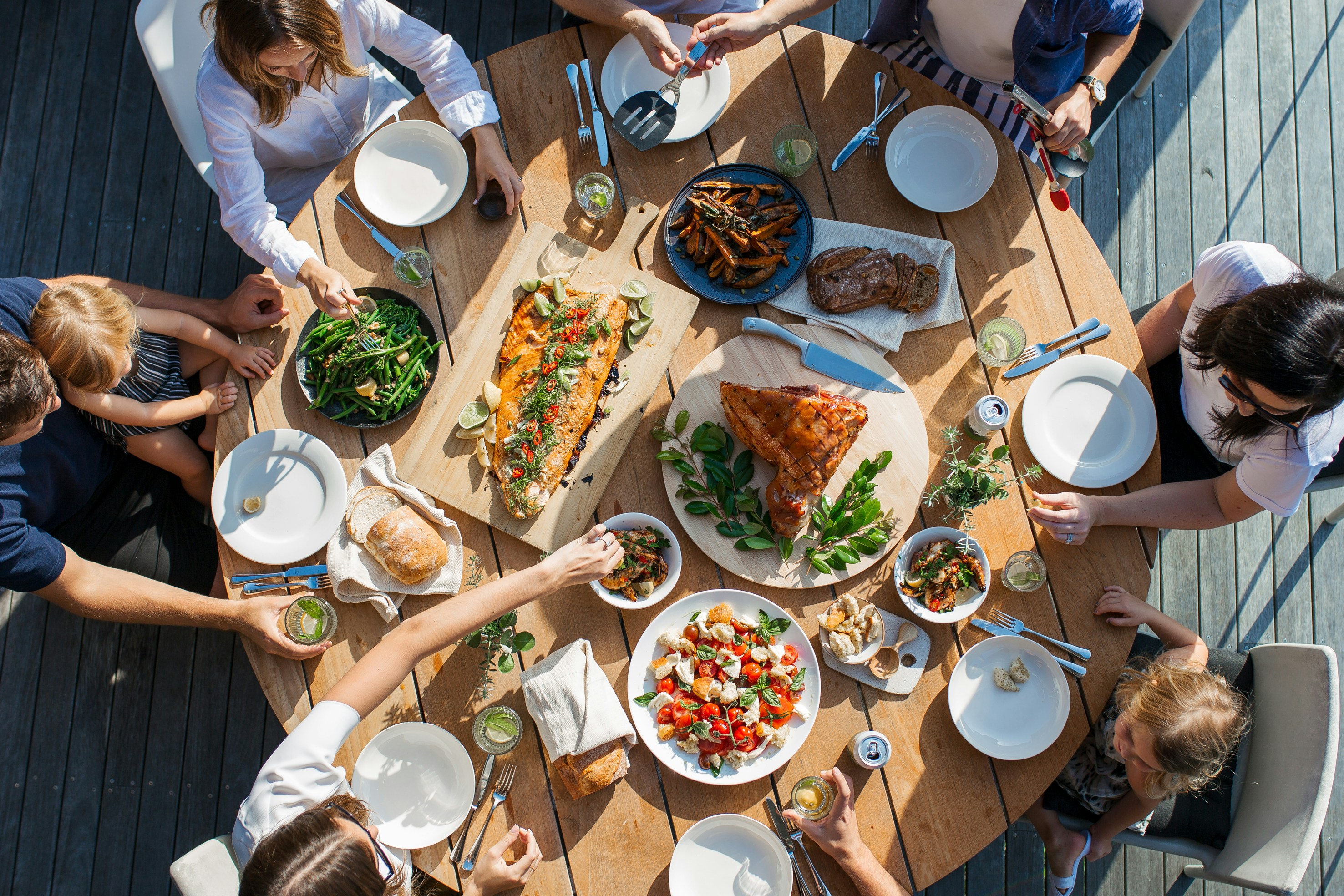Image of people around table - Luisa Brimble Image of people around table - Luisa Brimble