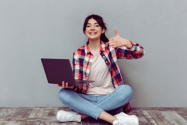 Lady with laptop looking happy and giving thumbs up as she has tamed her inbox! Lady with laptop looking happy and giving thumbs up as she has tamed her inbox!