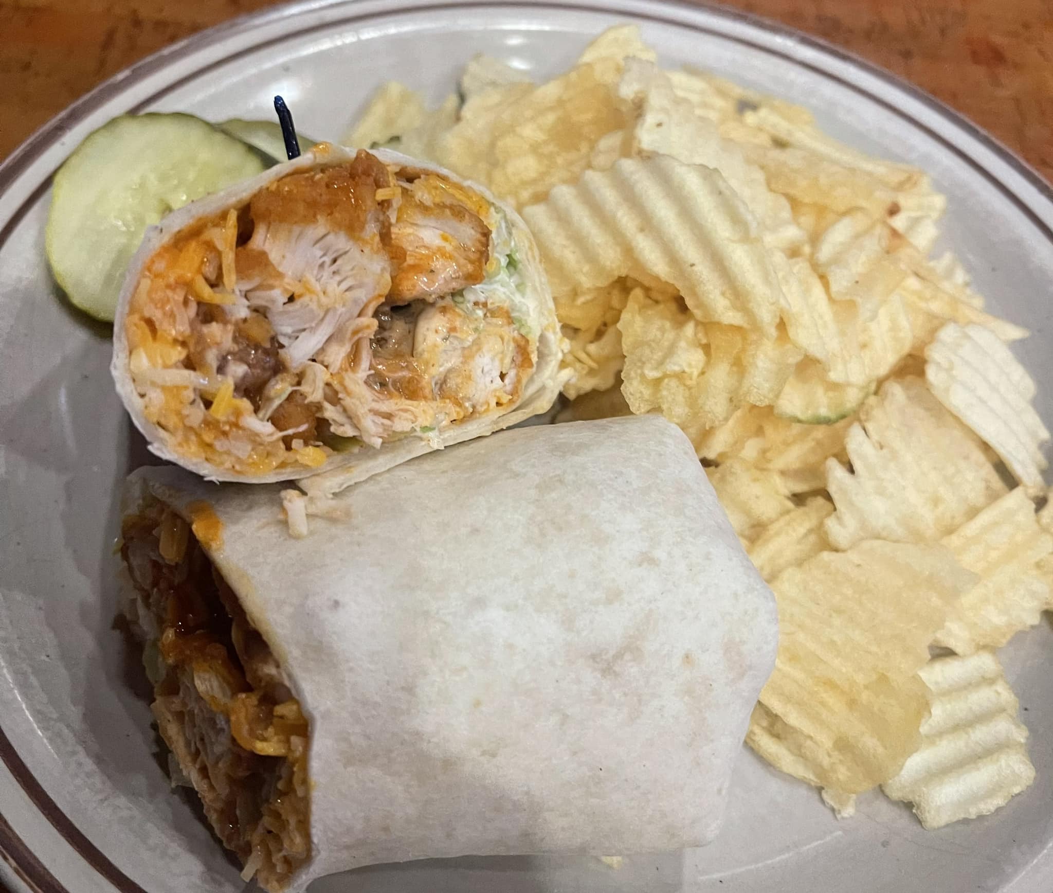 A chicken wrap and house chips