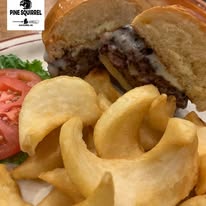 A Cheese Burger and potato wedges