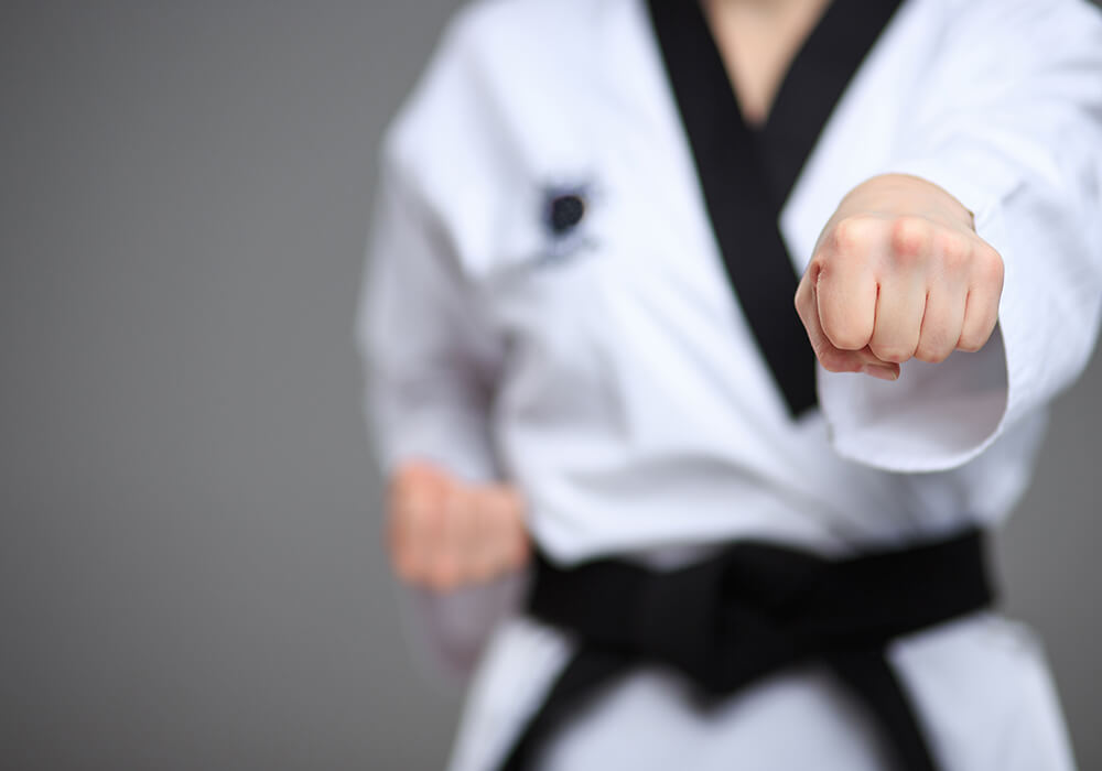 Martial arts instructor with kids
