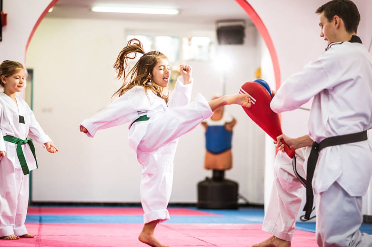 Martial arts instructor with kids