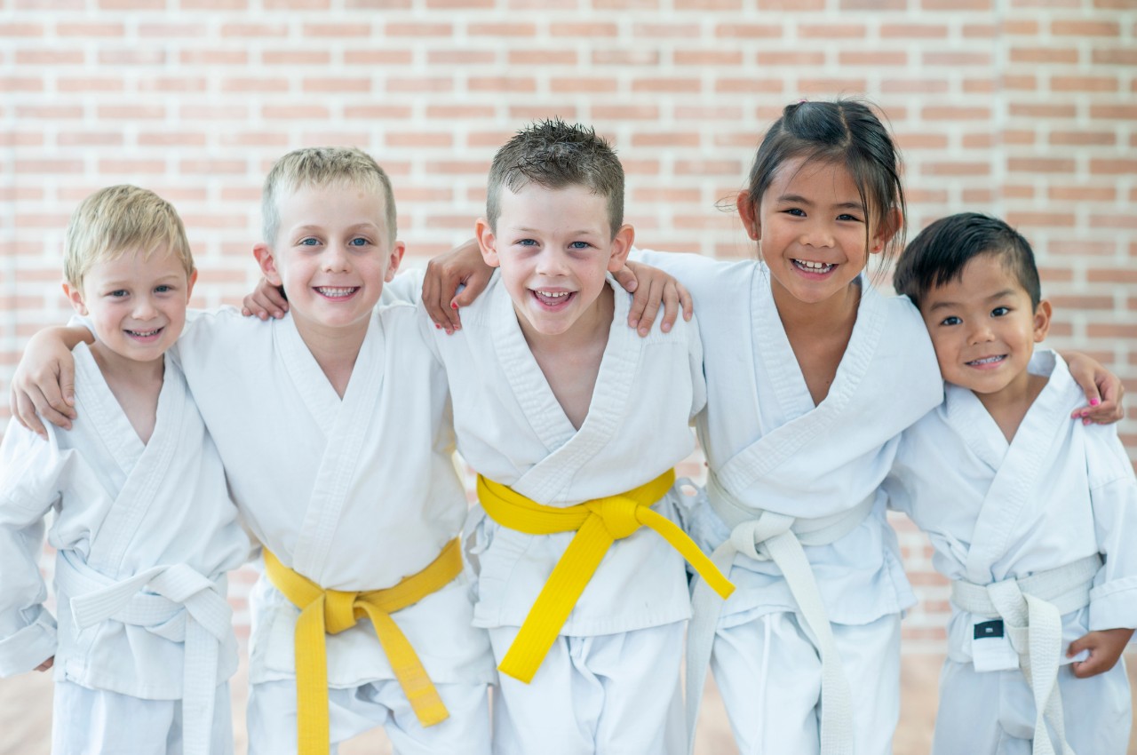 Martial arts instructor with kids